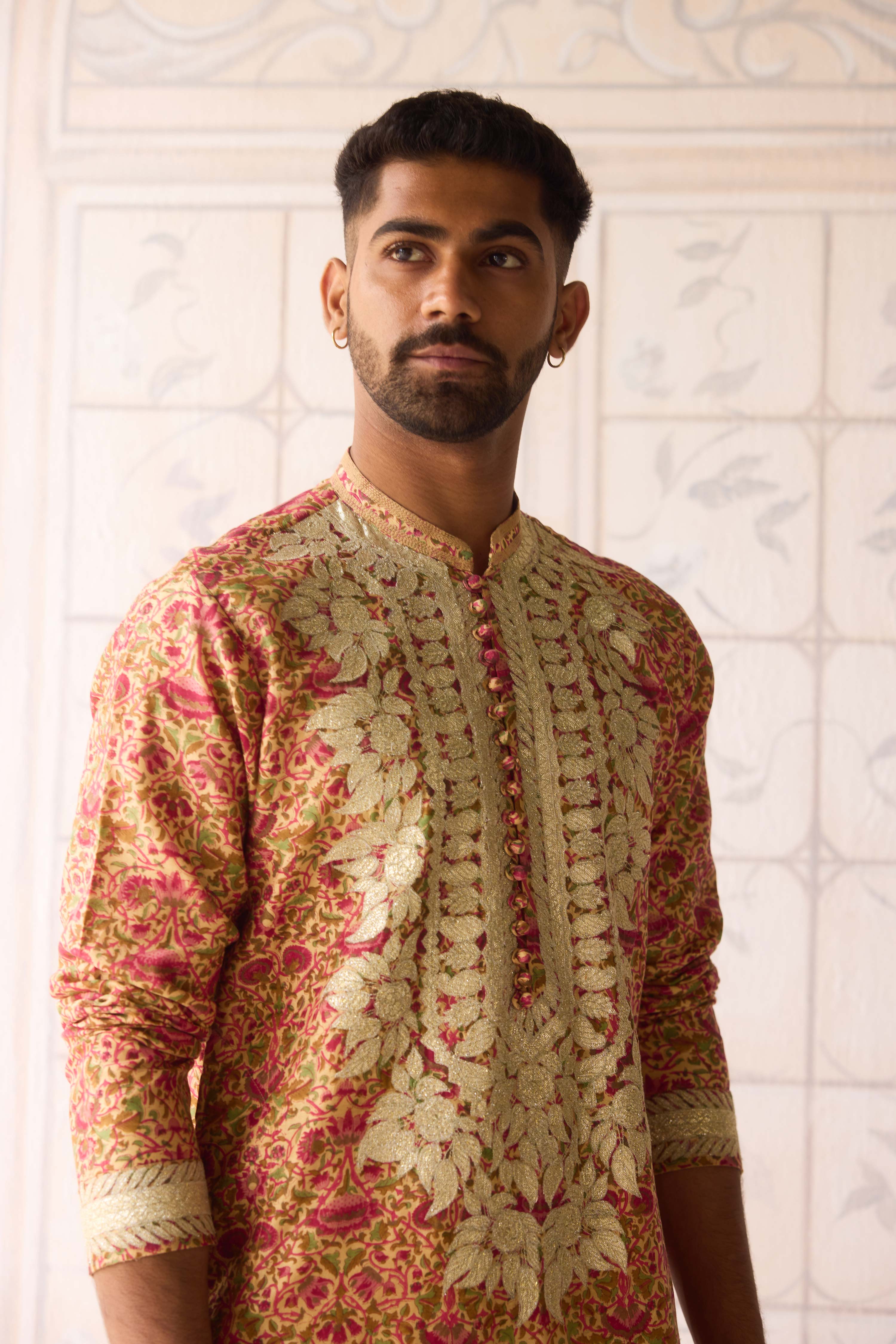 Handblock printed gold applique and thread embroidered kurta paired with embroidered raw silk waist coat