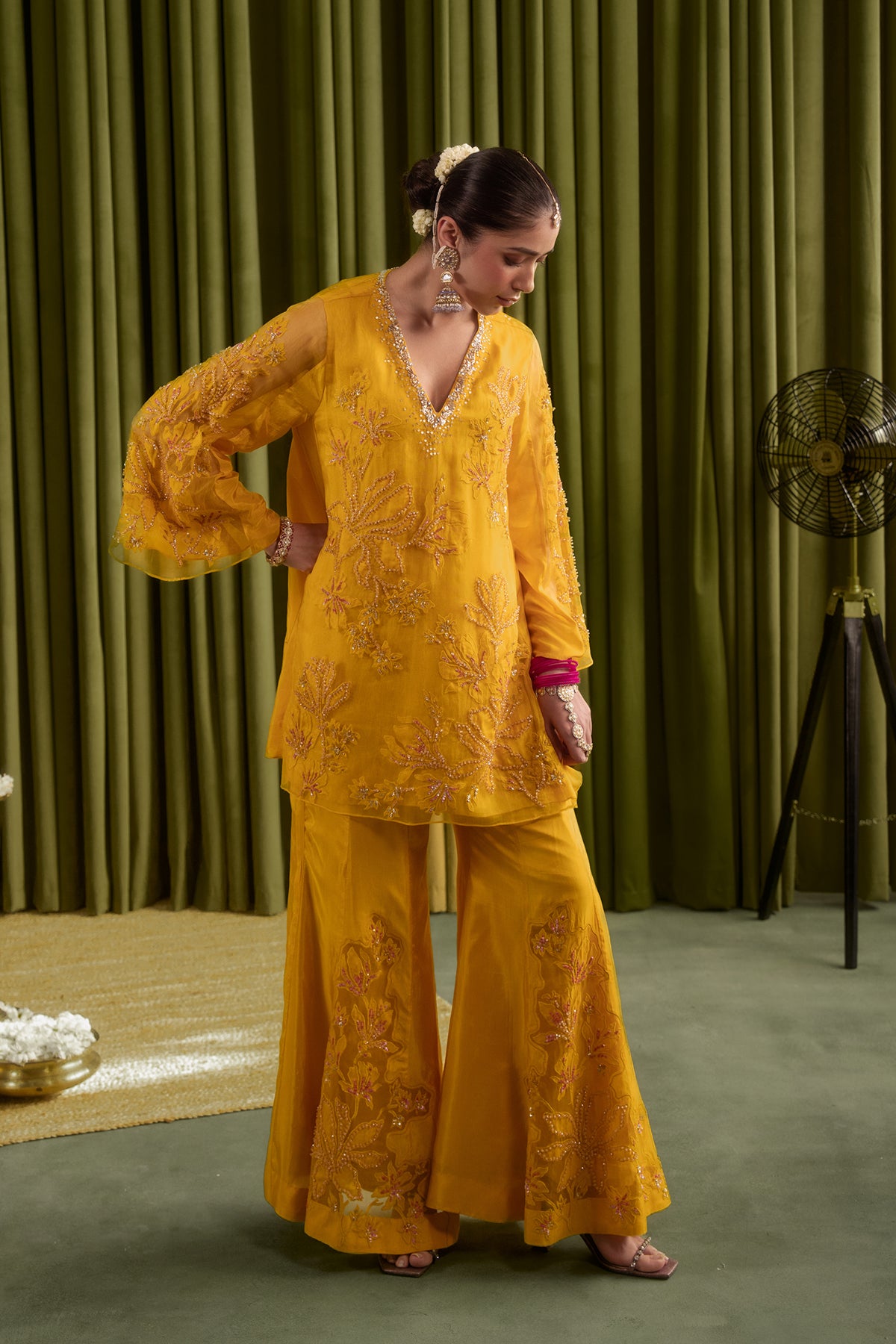 Golden yellow sharara set with embroidered magnolia flower pattern.