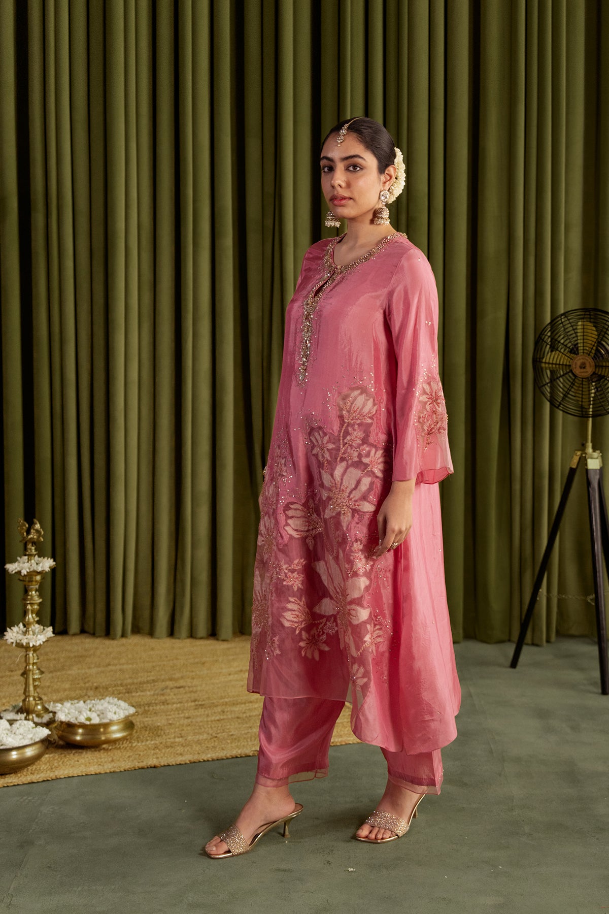 Rose pink kurta set in viscose silk base with embroidered magnolia flower pattern.