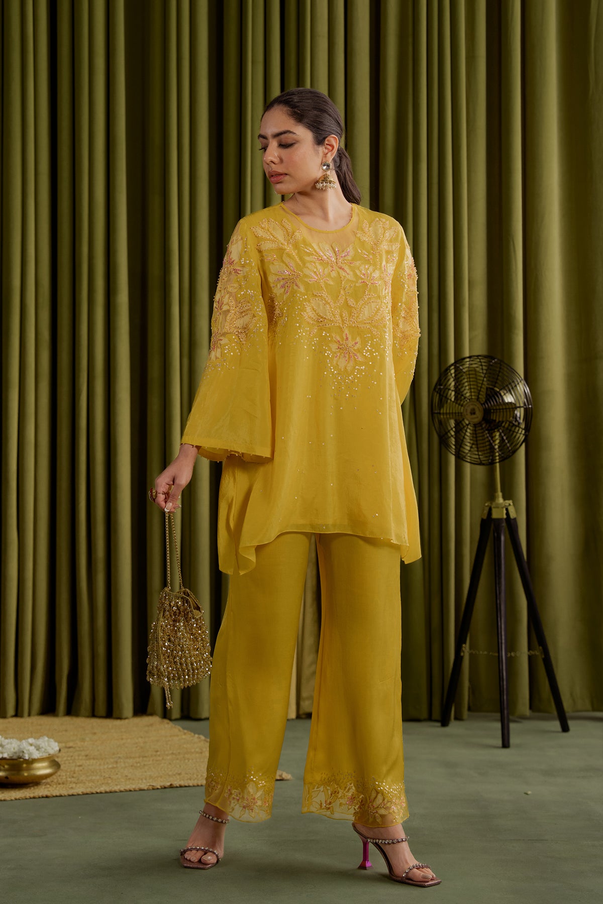 Mango co-ord set with embroidered magnolia flower pattern.