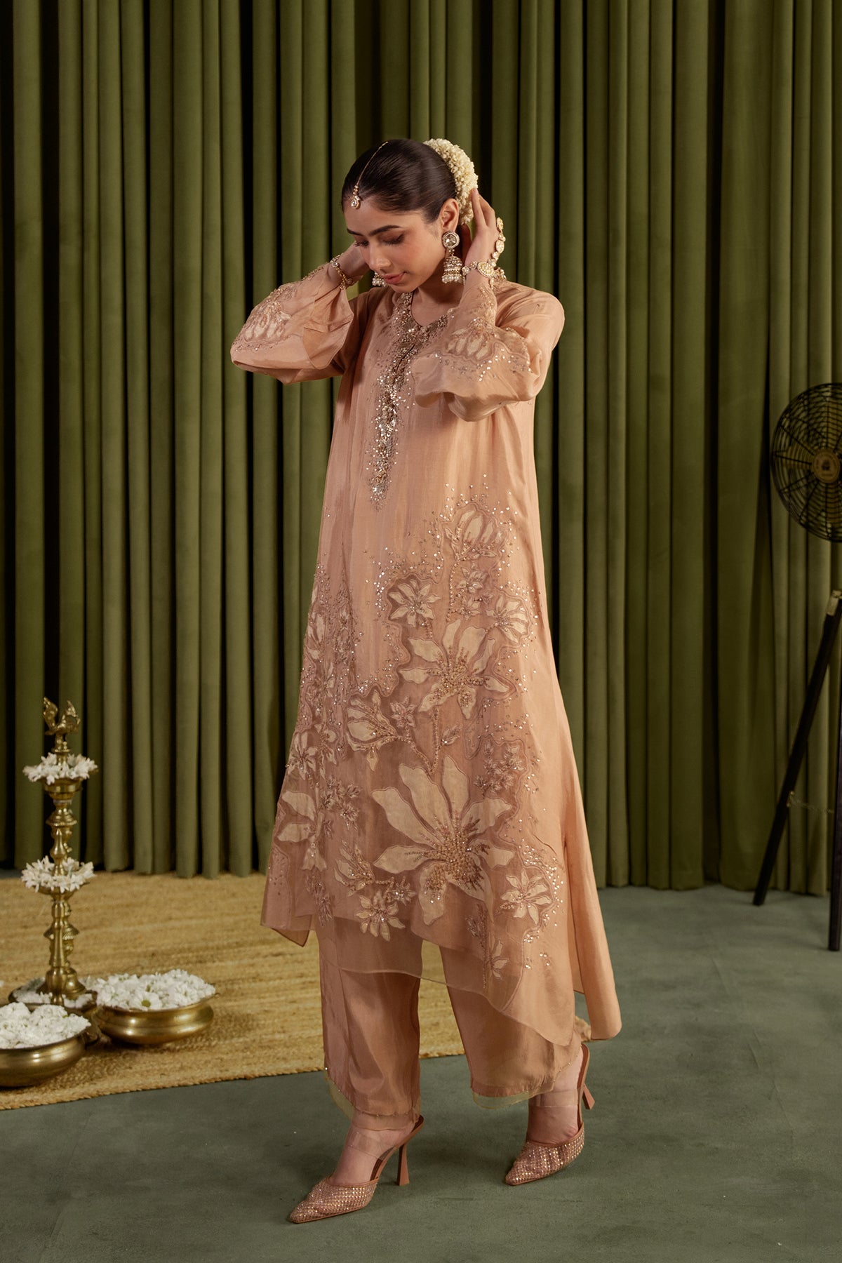 Golden beige kurta set in viscose silk base with embroidered magnolia flower pattern.