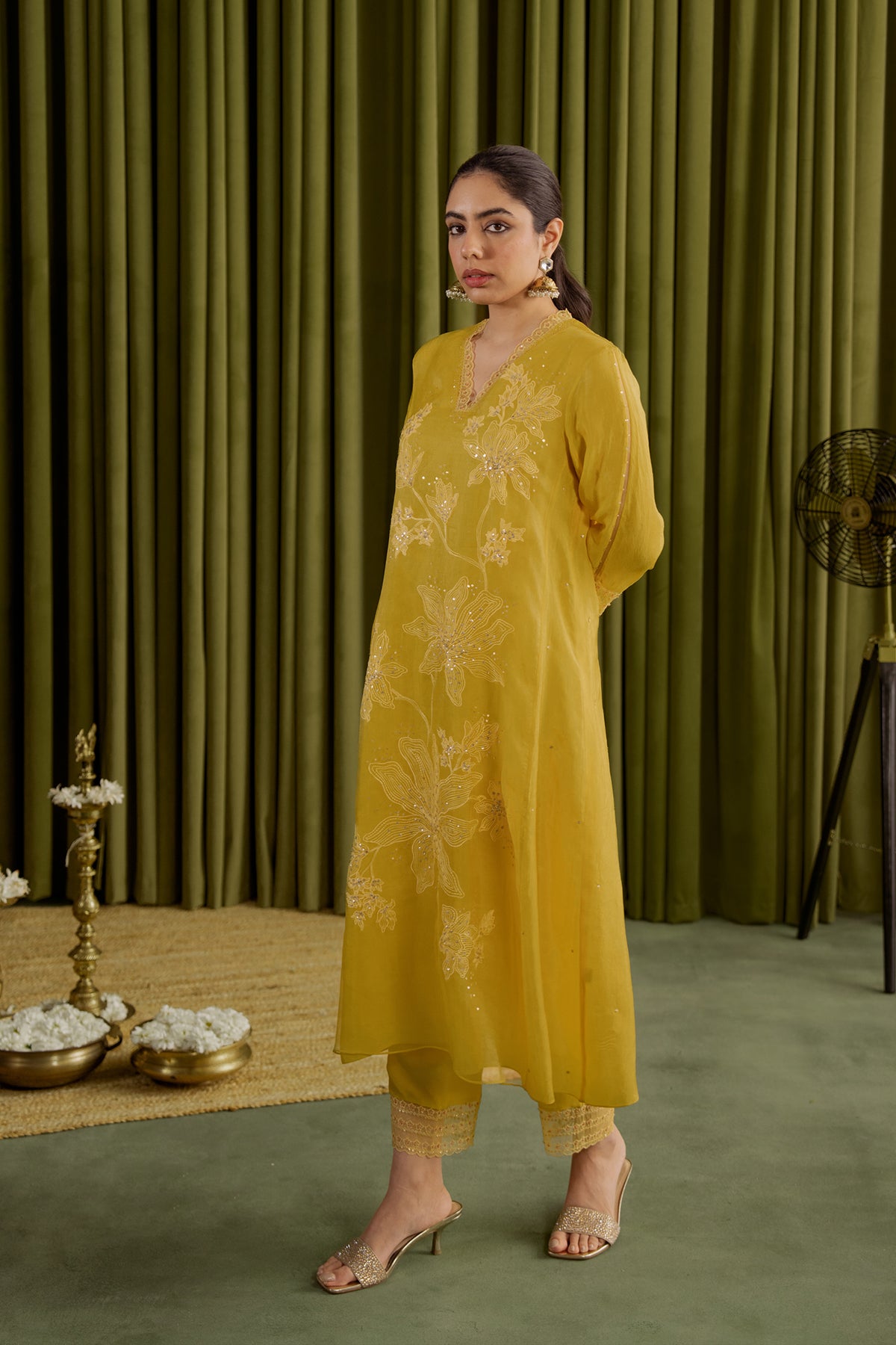 Mango kurta set with delicate floral embroidery.