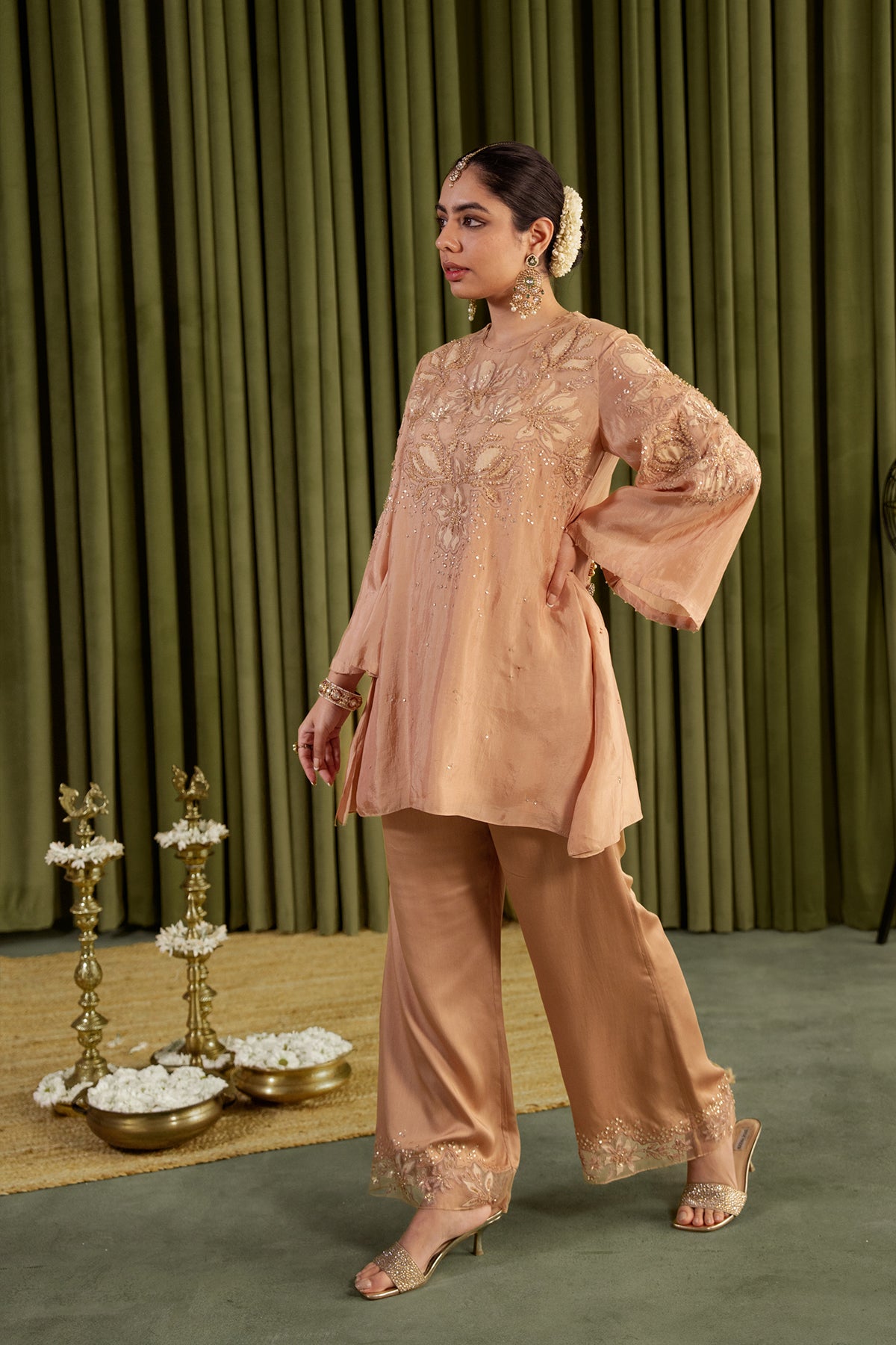 Golden beige co-ord set with embroidered magnolia flower pattern.