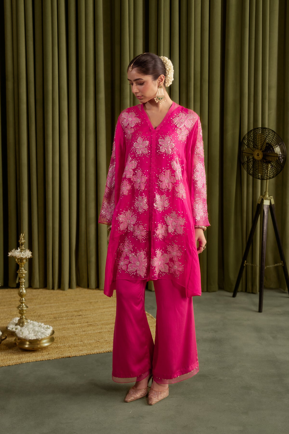Hot pink co-ord set with embroidered floral pattern.