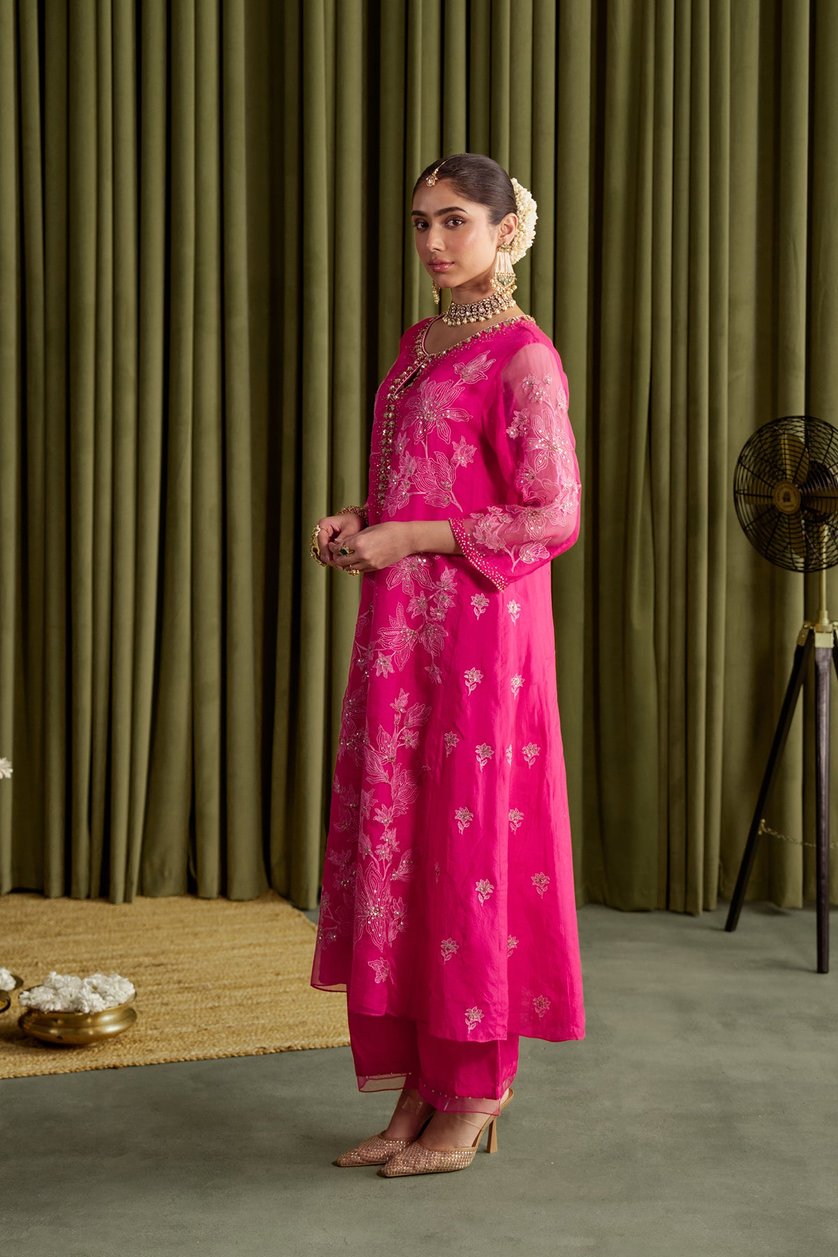 Hot pink kalidar kurta set with delicate floral embroidery.