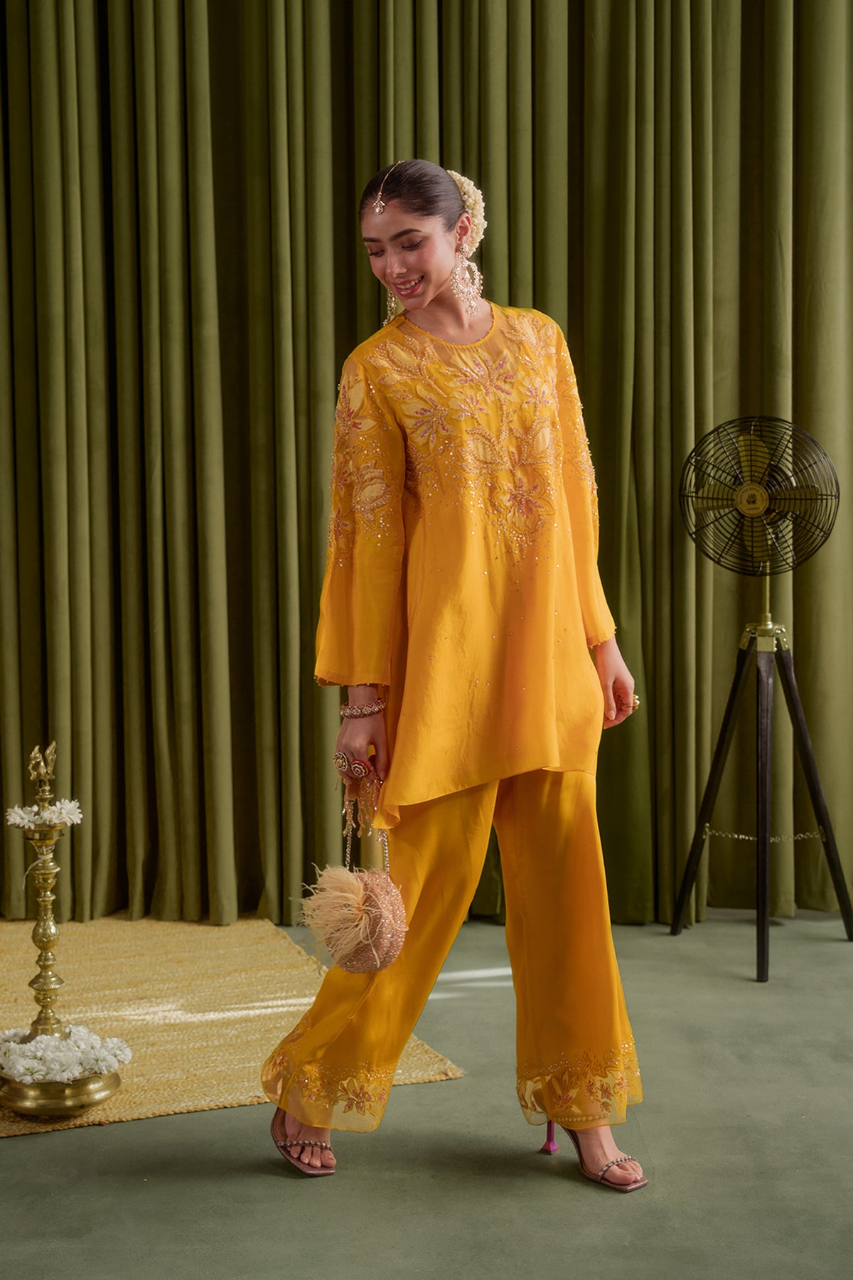 Golden yellow co-ord set with embroidered magnolia flower pattern.