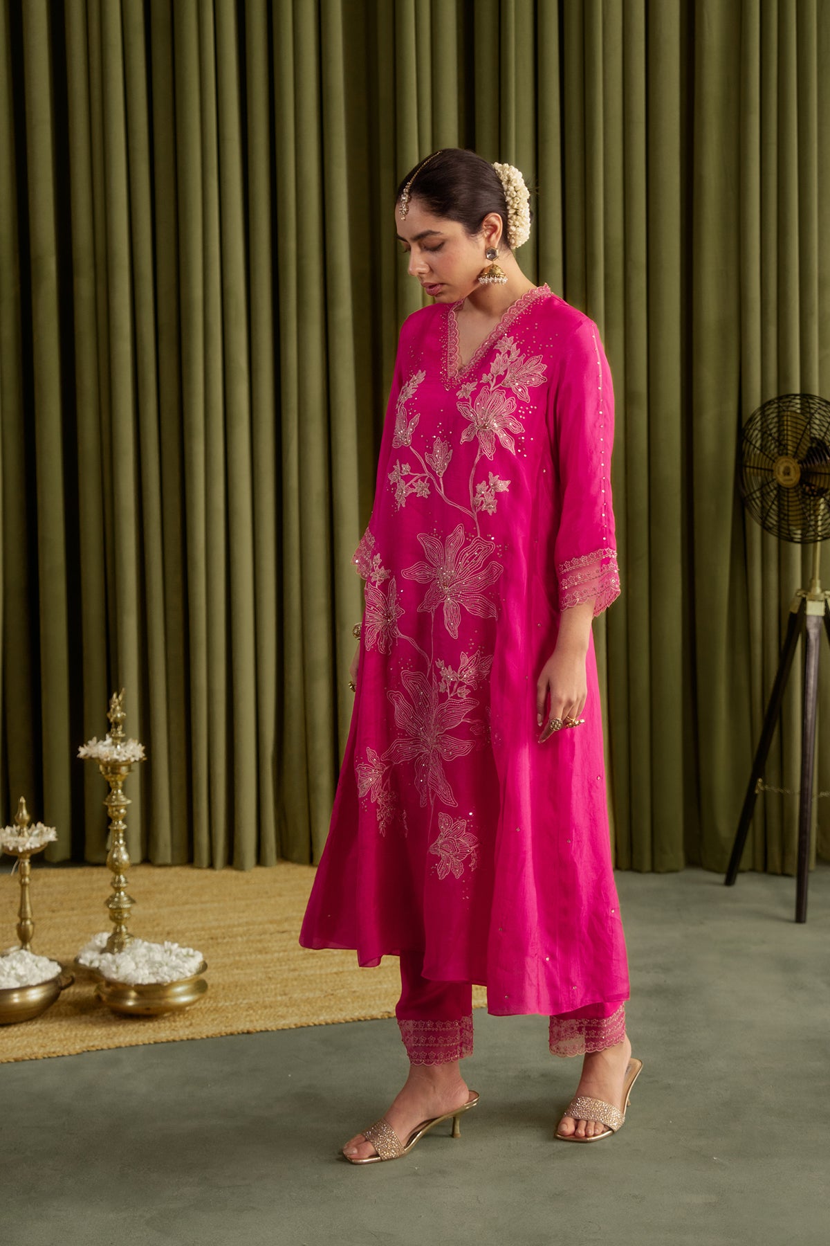 Hot pink kurta set with delicate floral embroidery.