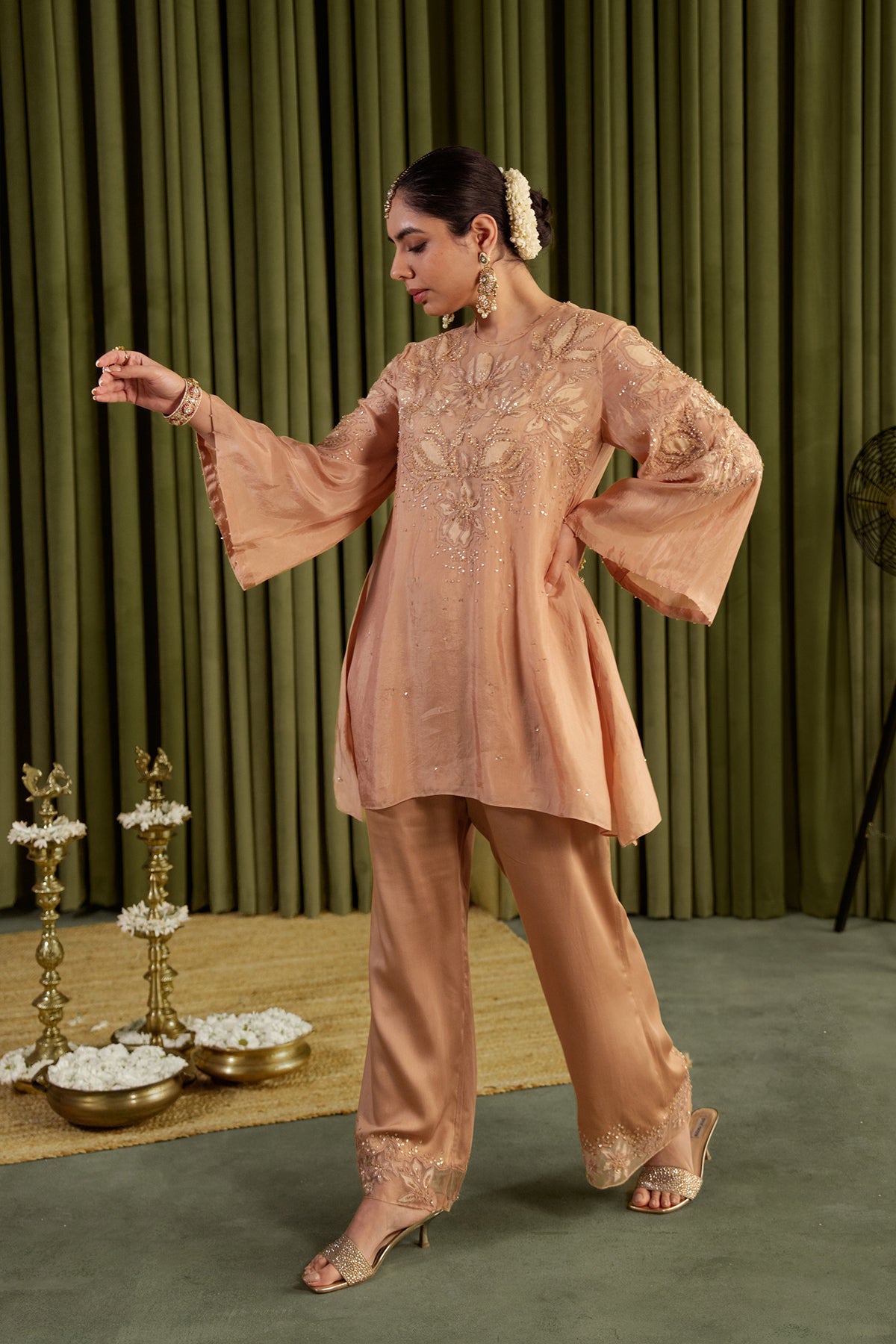 Golden beige co-ord set with embroidered magnolia flower pattern.