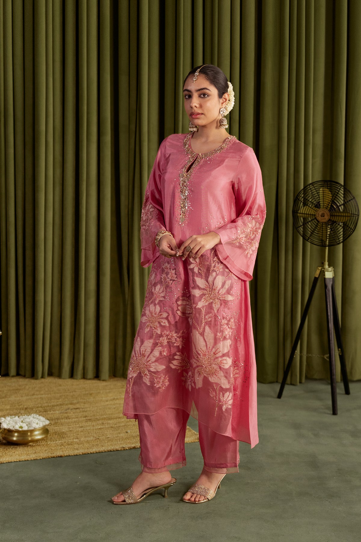 Rose pink kurta set in viscose silk base with embroidered magnolia flower pattern.