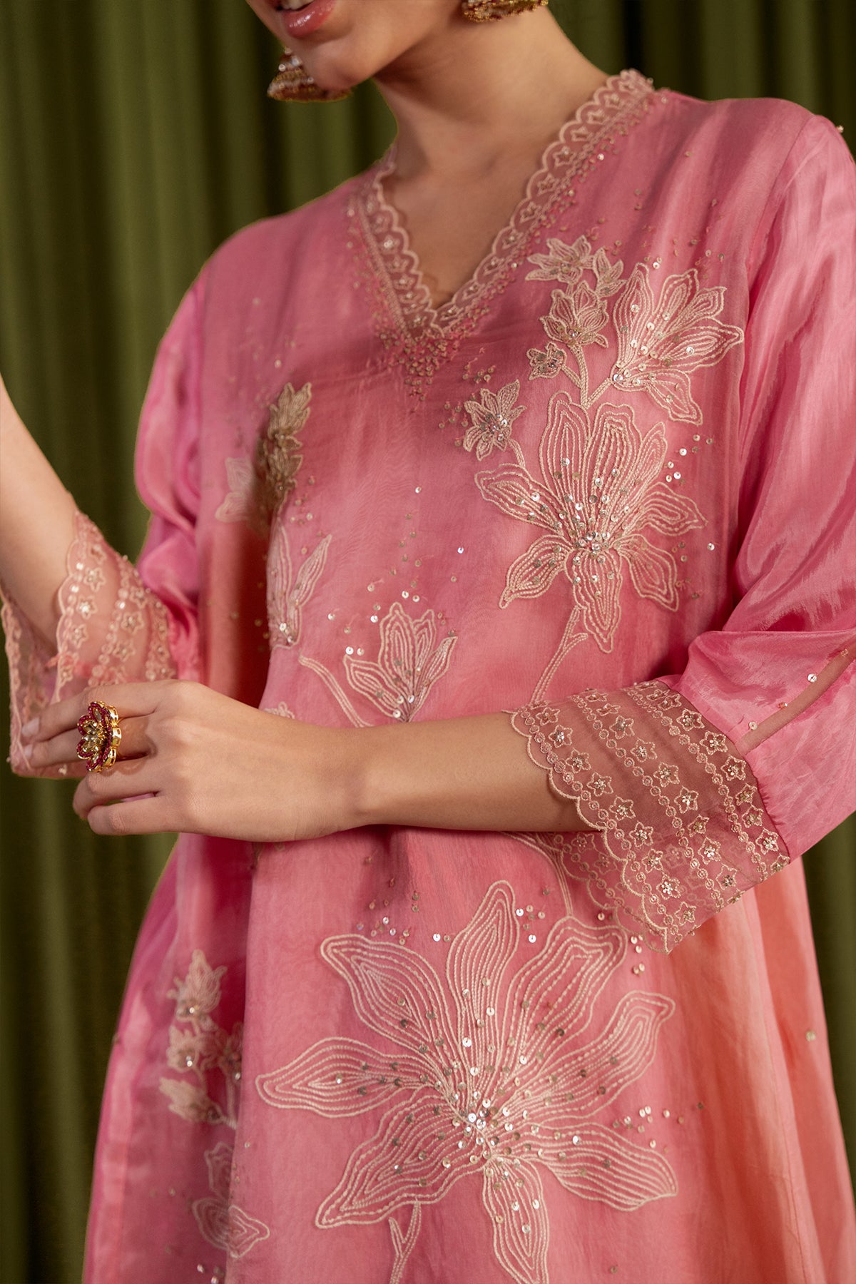Rose pink kurta set with delicate floral embroidery.