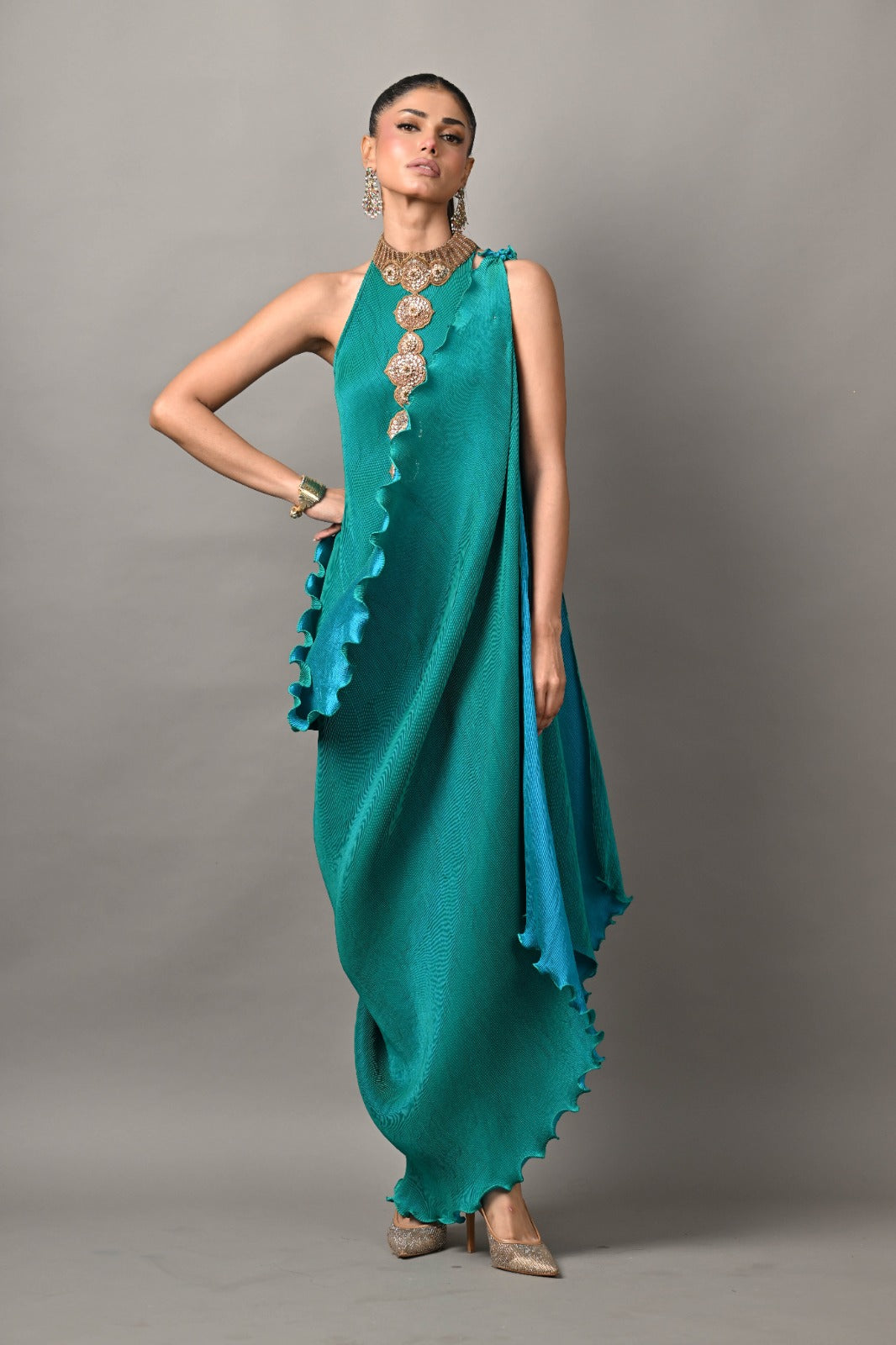 Bright turquoise pleated diagonal dress with collar with moresque embroidery and pleated drape