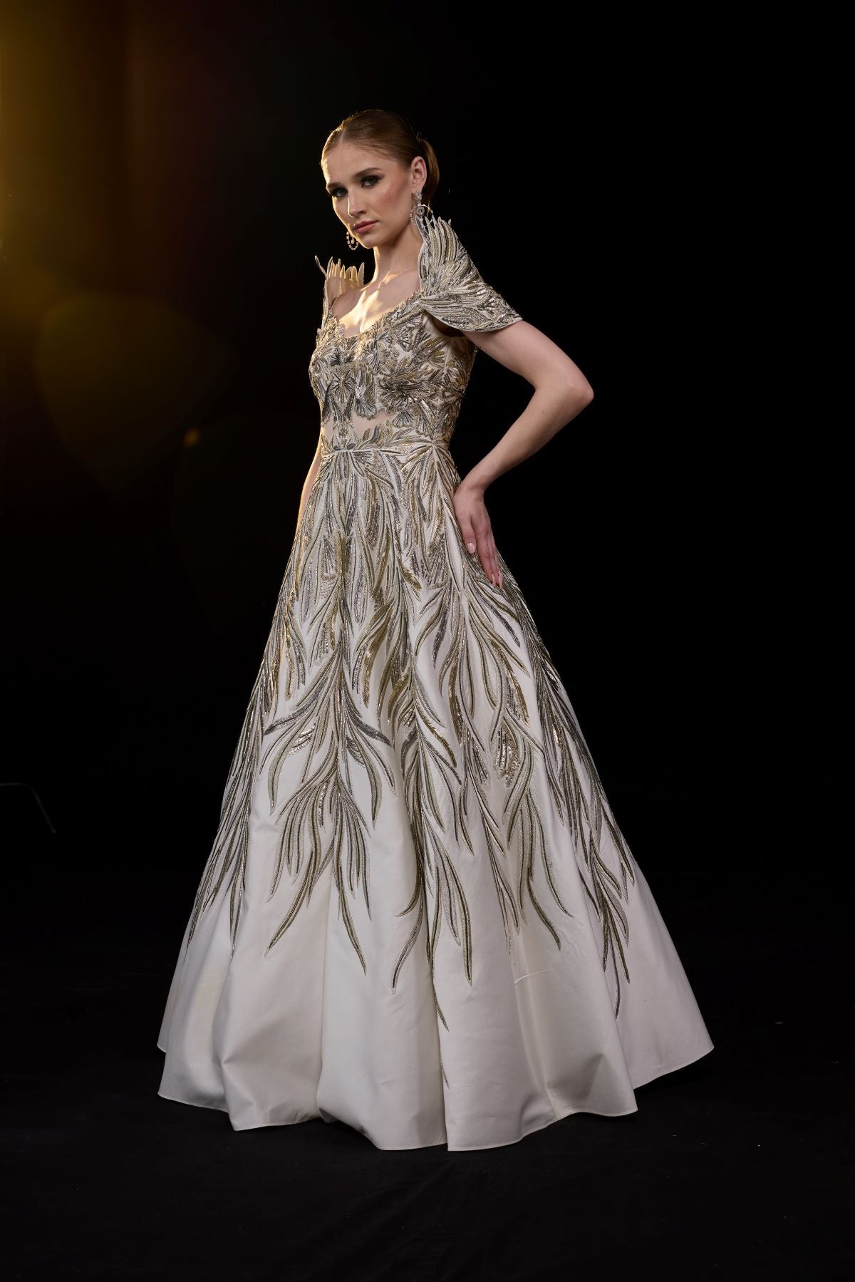 https://cdn.shopify.com/s/files/1/0088/3441/6706/files/a-elegant-gown-features-an-off-shoulder-design-with-structured-sleeves-3751639.jpg?v=1752388530
