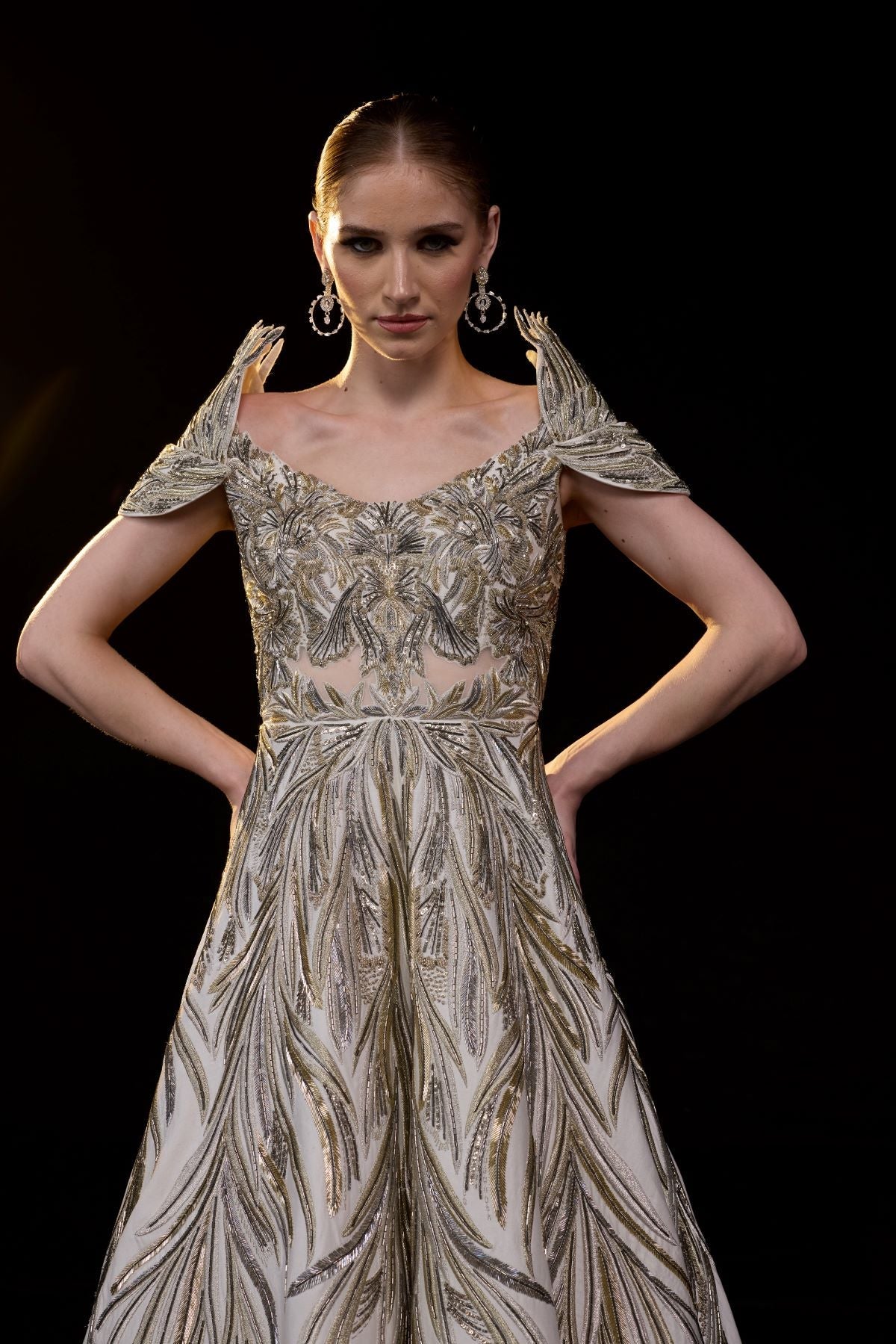 https://cdn.shopify.com/s/files/1/0088/3441/6706/files/a-elegant-gown-features-an-off-shoulder-design-with-structured-sleeves-7824382.jpg?v=1752388530