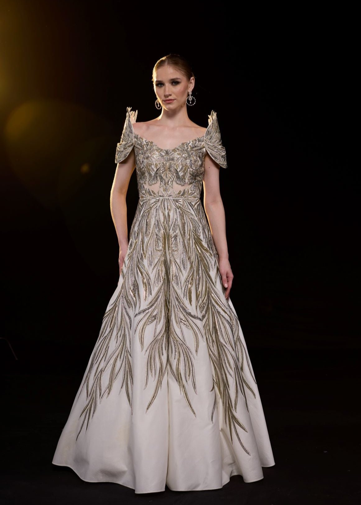 https://cdn.shopify.com/s/files/1/0088/3441/6706/files/a-elegant-gown-features-an-off-shoulder-design-with-structured-sleeves-8316835.jpg?v=1752388529