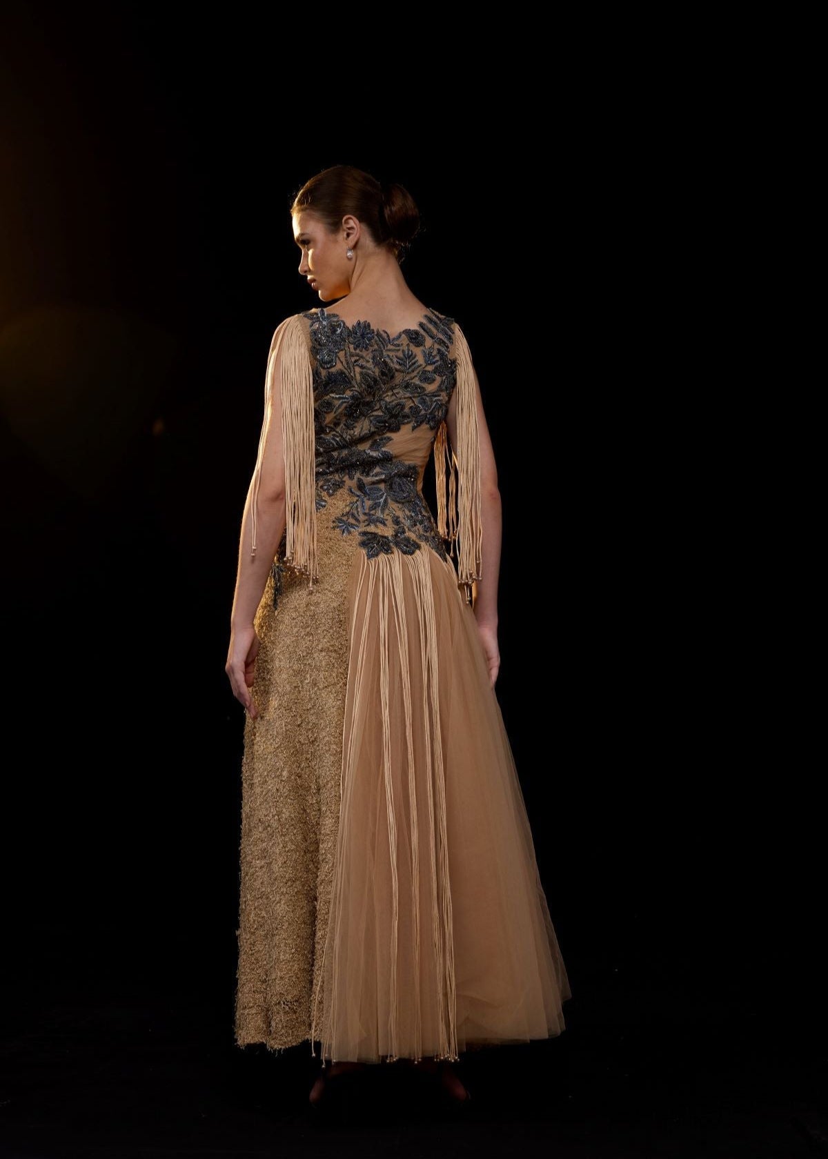https://cdn.shopify.com/s/files/1/0088/3441/6706/files/a-nude-toned-gown-adorned-with-intricate-blue-floral-embroidery-and-dramatic-fringe-sleeves-6675085.jpg?v=1752926529