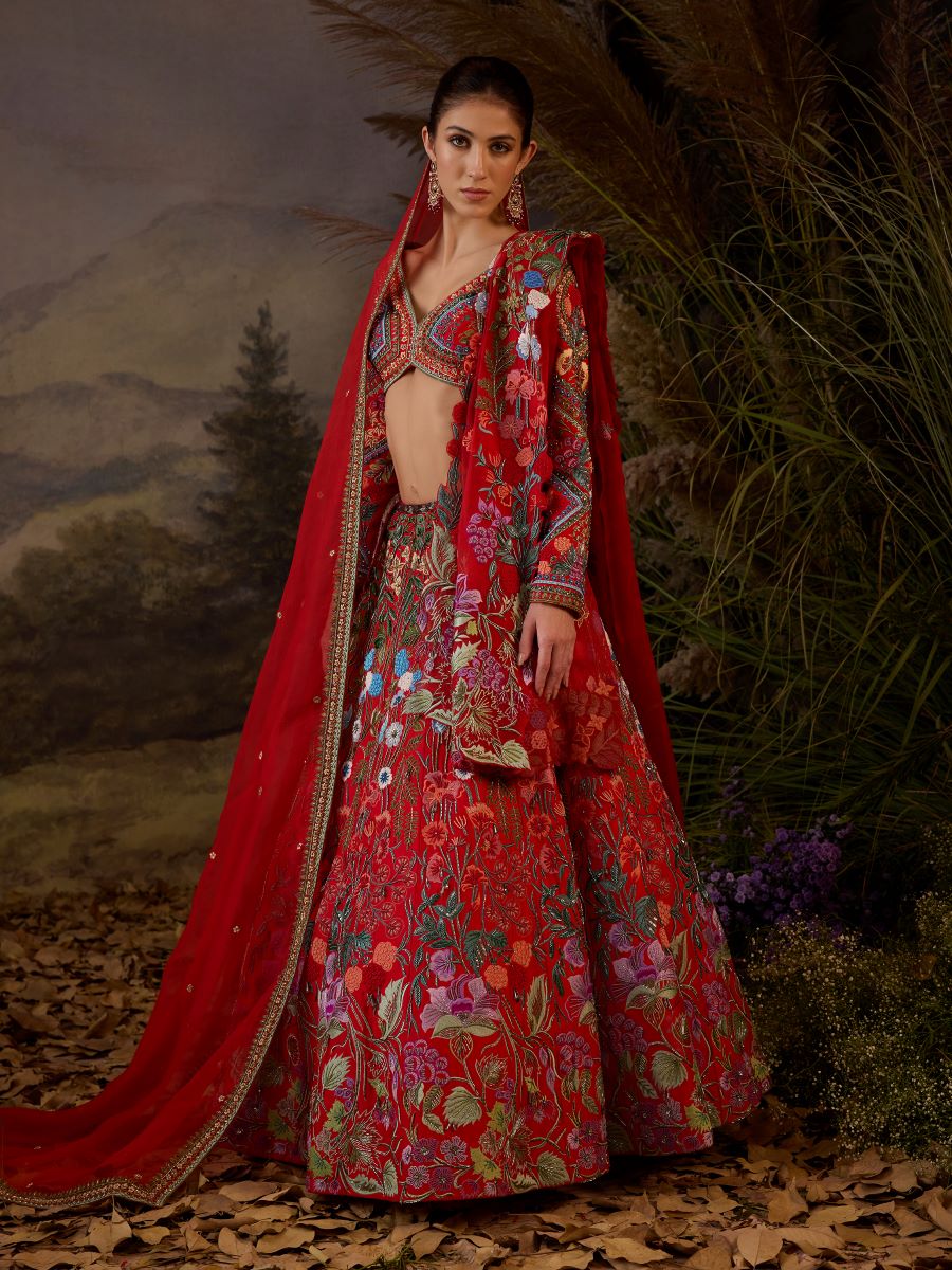 https://cdn.shopify.com/s/files/1/0088/3441/6706/files/a-red-organza-cotton-silk-lengha-with-v-neck-line-6989891.jpg?v=1752388669