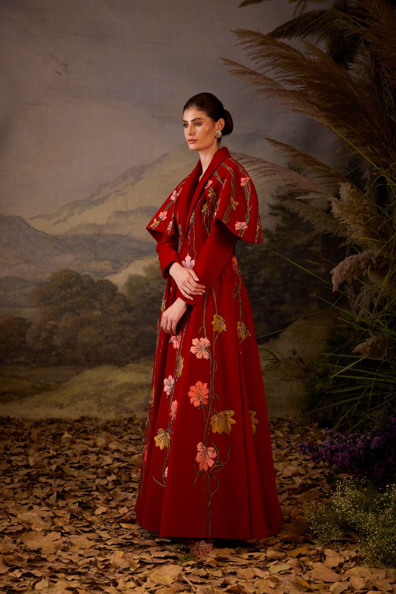 https://cdn.shopify.com/s/files/1/0088/3441/6706/files/a-red-velvet-fabric-floor-length-gown-with-lapel-neck-line-extended-cape-6039893.jpg?v=1752388666