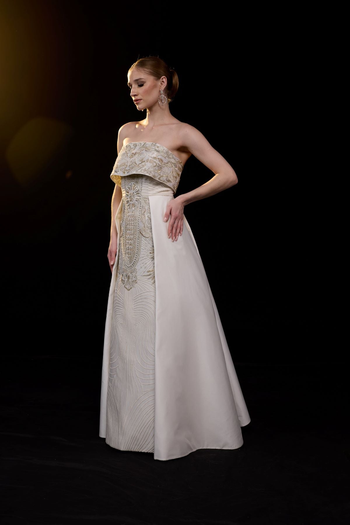 https://cdn.shopify.com/s/files/1/0088/3441/6706/files/a-sophisticated-strapless-gown-showcases-intricate-gold-embroidery-3504659.jpg?v=1752388530