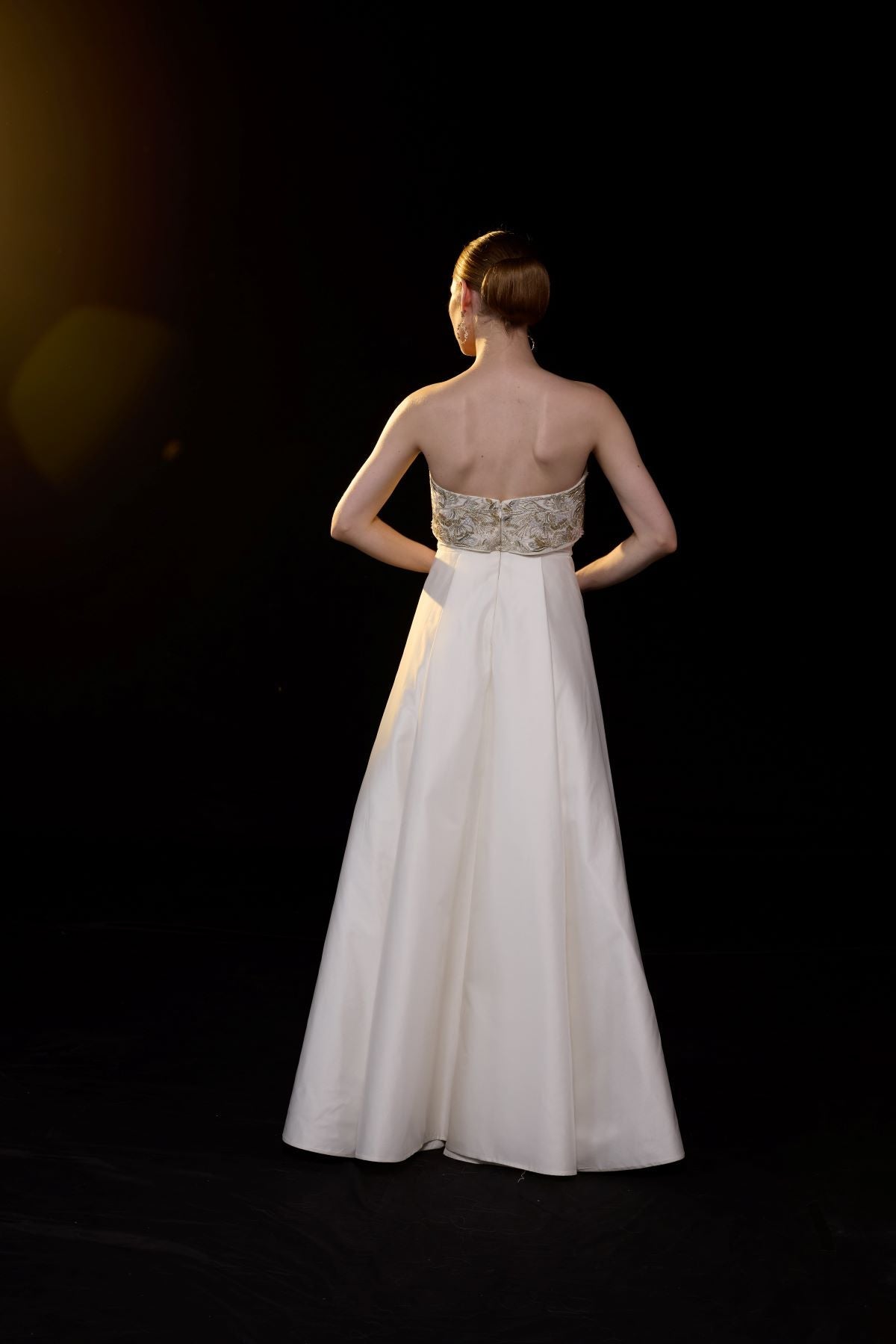 https://cdn.shopify.com/s/files/1/0088/3441/6706/files/a-sophisticated-strapless-gown-showcases-intricate-gold-embroidery-9985080.jpg?v=1752388529