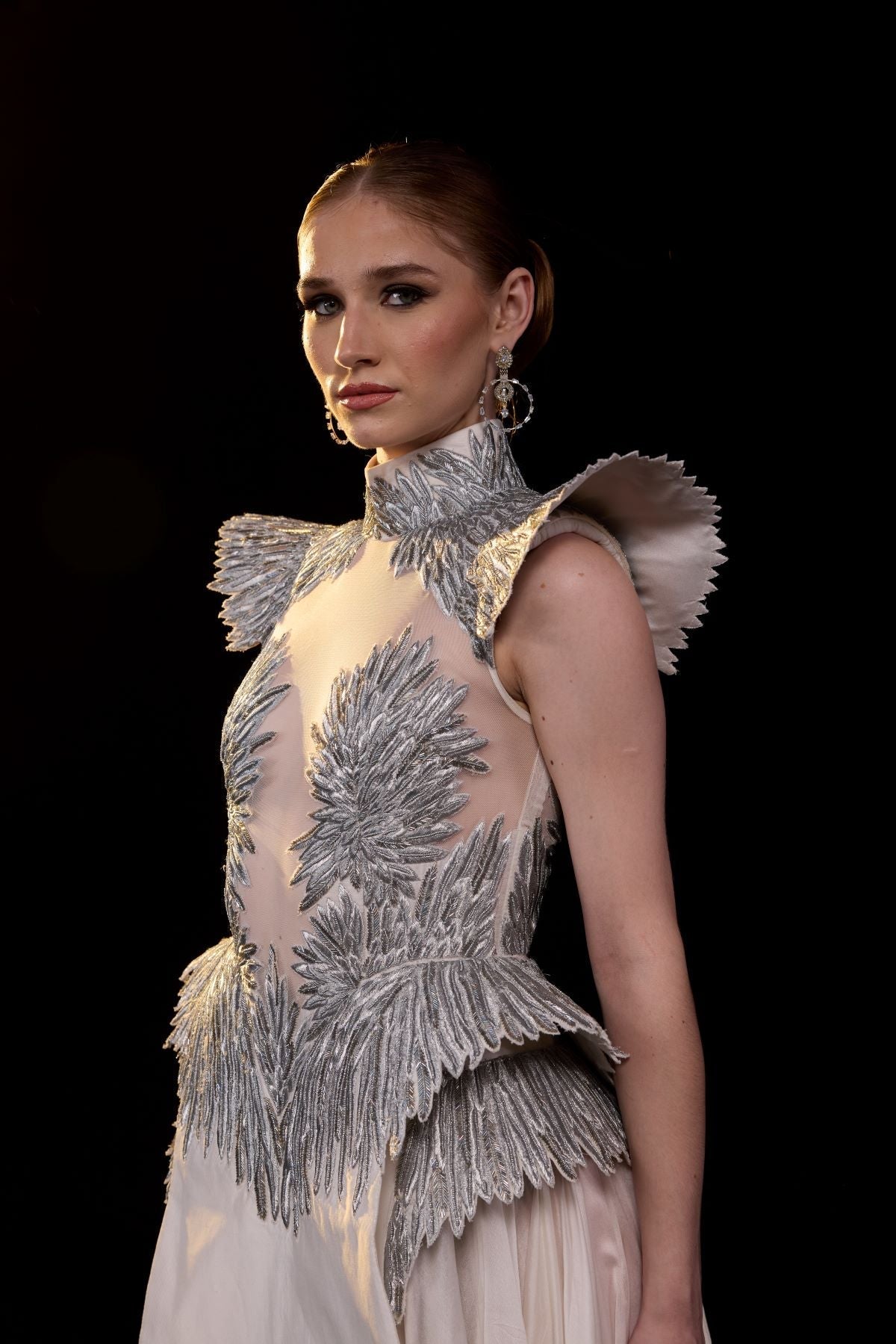 https://cdn.shopify.com/s/files/1/0088/3441/6706/files/a-striking-evening-gown-featuring-a-sculptural-4650571.jpg?v=1752388530
