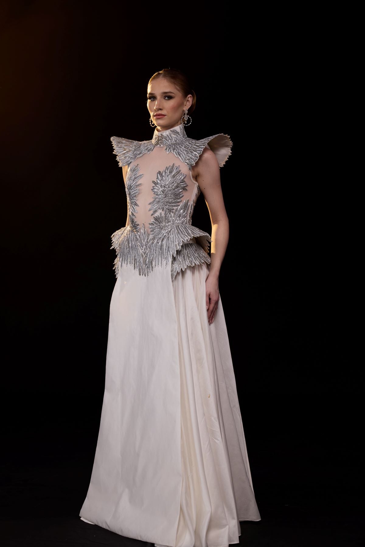 https://cdn.shopify.com/s/files/1/0088/3441/6706/files/a-striking-evening-gown-featuring-a-sculptural-6702411.jpg?v=1752388530
