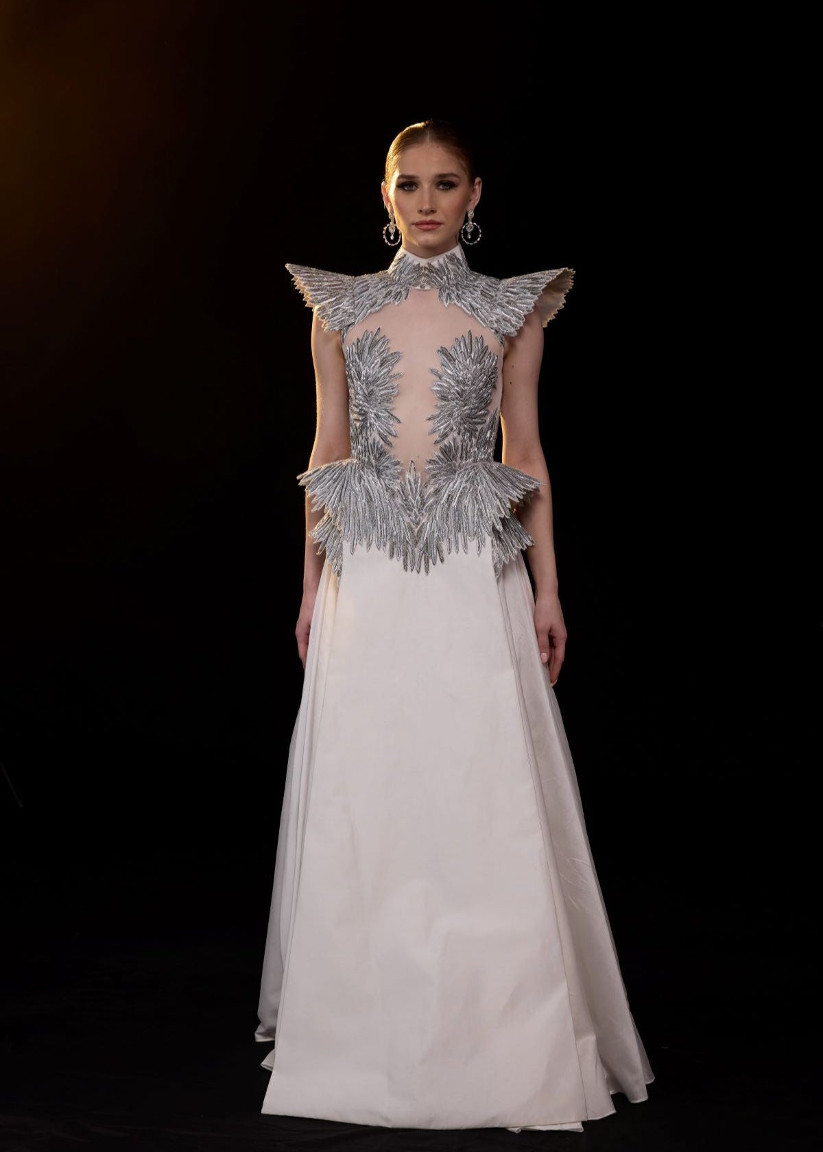 https://cdn.shopify.com/s/files/1/0088/3441/6706/files/a-striking-evening-gown-featuring-a-sculptural-9625812.jpg?v=1752388528