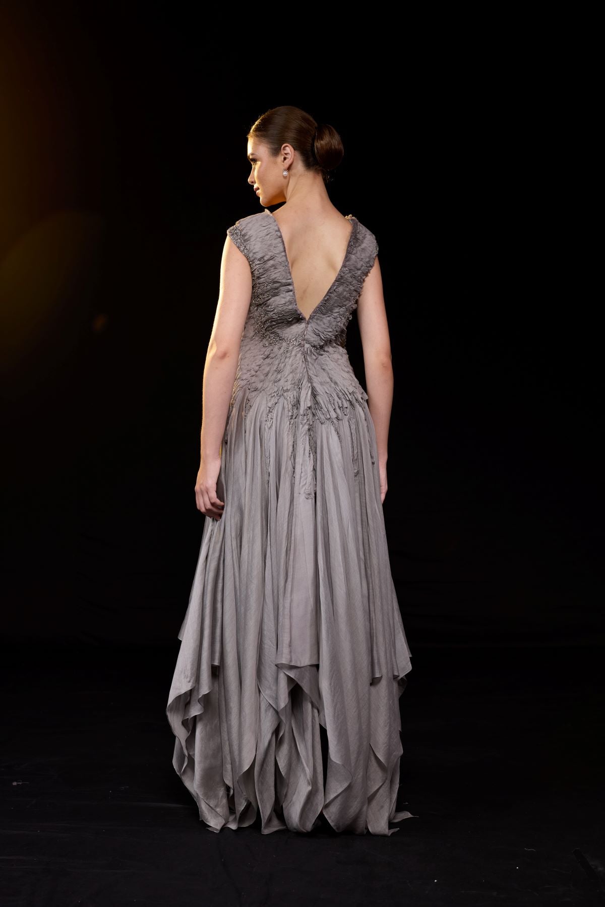https://cdn.shopify.com/s/files/1/0088/3441/6706/files/a-striking-grey-gown-features-a-deep-v-neckline-and-delicately-ruched-bodice-5944981.jpg?v=1752388531