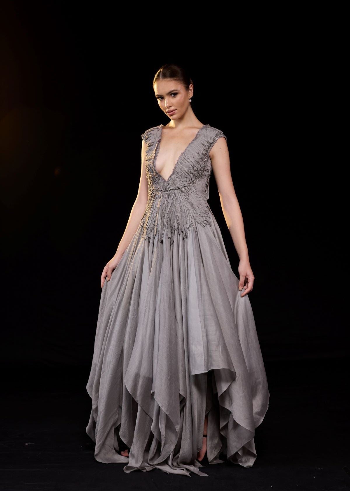 https://cdn.shopify.com/s/files/1/0088/3441/6706/files/a-striking-grey-gown-features-a-deep-v-neckline-and-delicately-ruched-bodice-7520920.jpg?v=1752388530