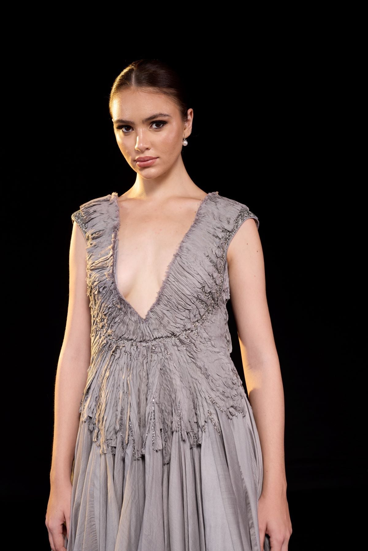 https://cdn.shopify.com/s/files/1/0088/3441/6706/files/a-striking-grey-gown-features-a-deep-v-neckline-and-delicately-ruched-bodice-8977083.jpg?v=1752388531