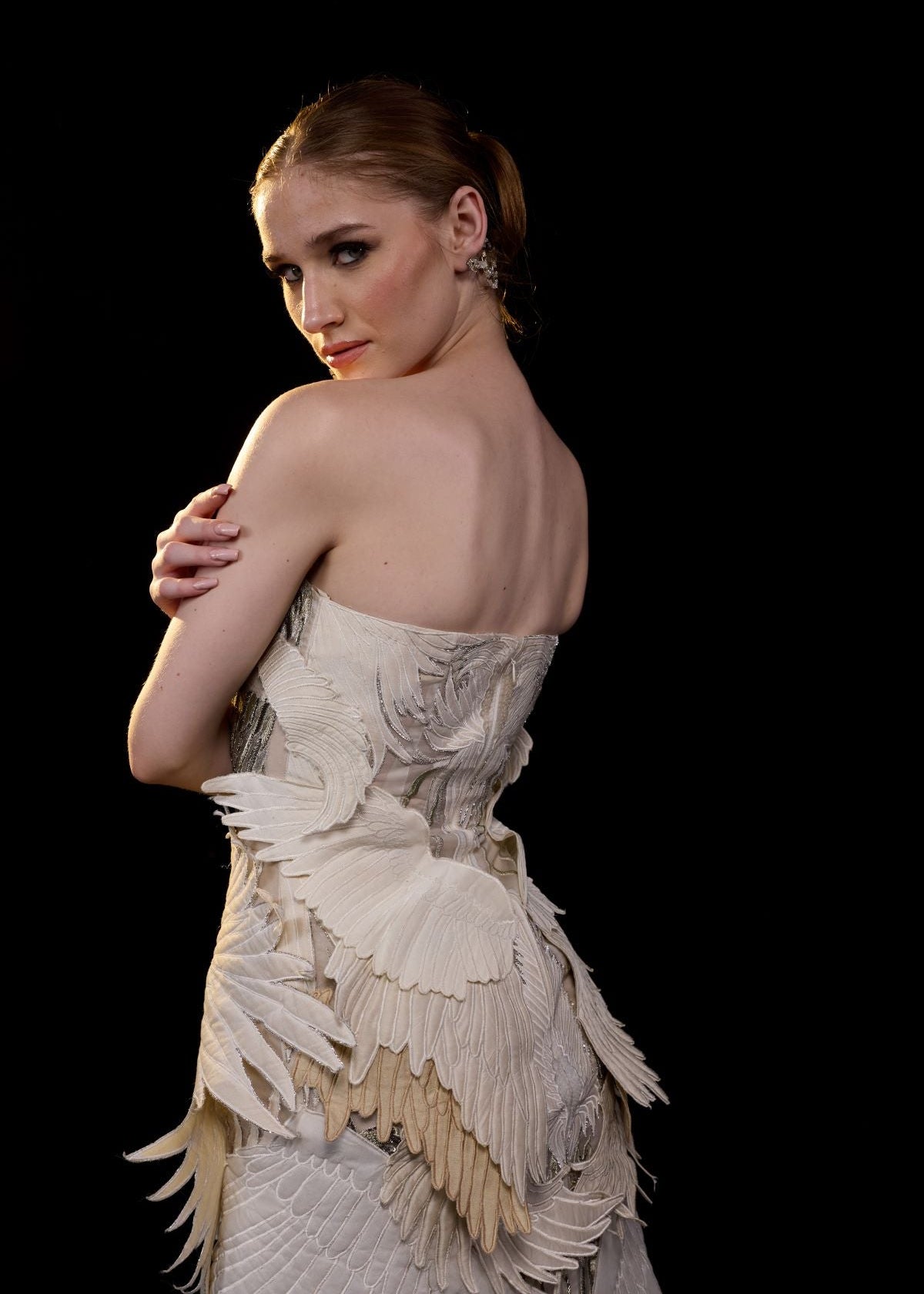 https://cdn.shopify.com/s/files/1/0088/3441/6706/files/an-ethereal-strapless-gown-crafted-with-layered-organza-wings-in-soft-ivory-and-beige-tones-5650233.jpg?v=1753781133
