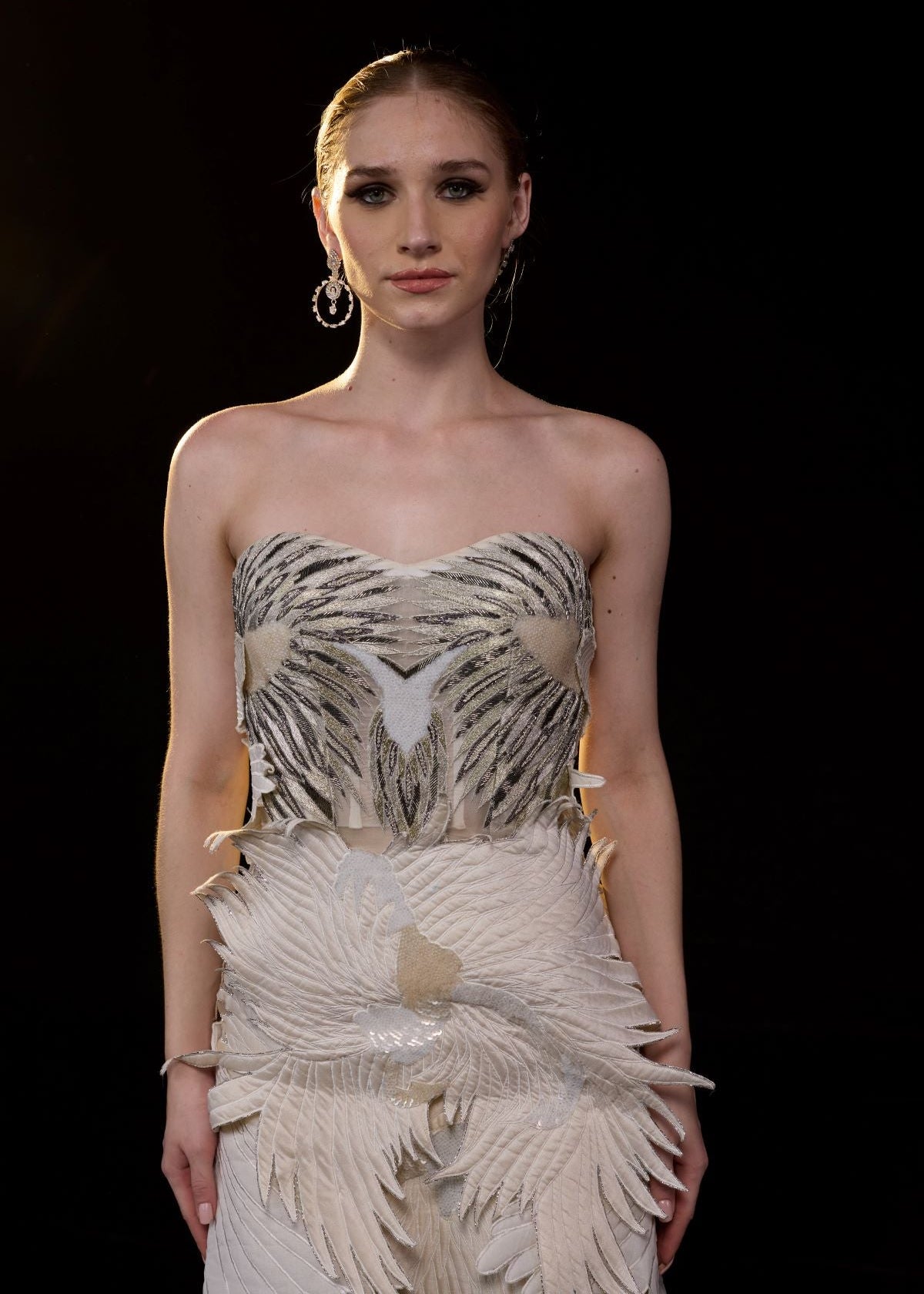 https://cdn.shopify.com/s/files/1/0088/3441/6706/files/an-ethereal-strapless-gown-crafted-with-layered-organza-wings-in-soft-ivory-and-beige-tones-8976384.jpg?v=1753781133