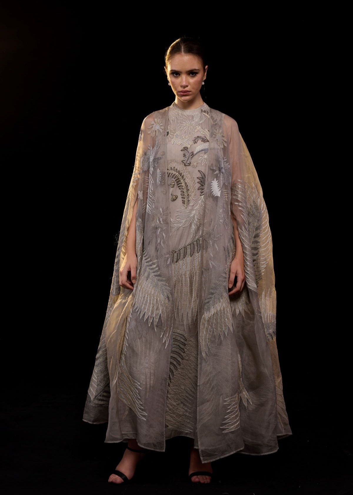 https://cdn.shopify.com/s/files/1/0088/3441/6706/files/ethereal-embroidered-gown-featuring-a-flowing-silhouette-and-a-sheer-cape-overlay-4267664.jpg?v=1753781127