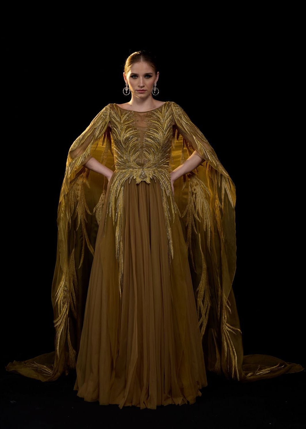 https://cdn.shopify.com/s/files/1/0088/3441/6706/files/golden-bronze-embroidered-gown-with-elegant-flowing-cape-sleeves-5137680.jpg?v=1752388529