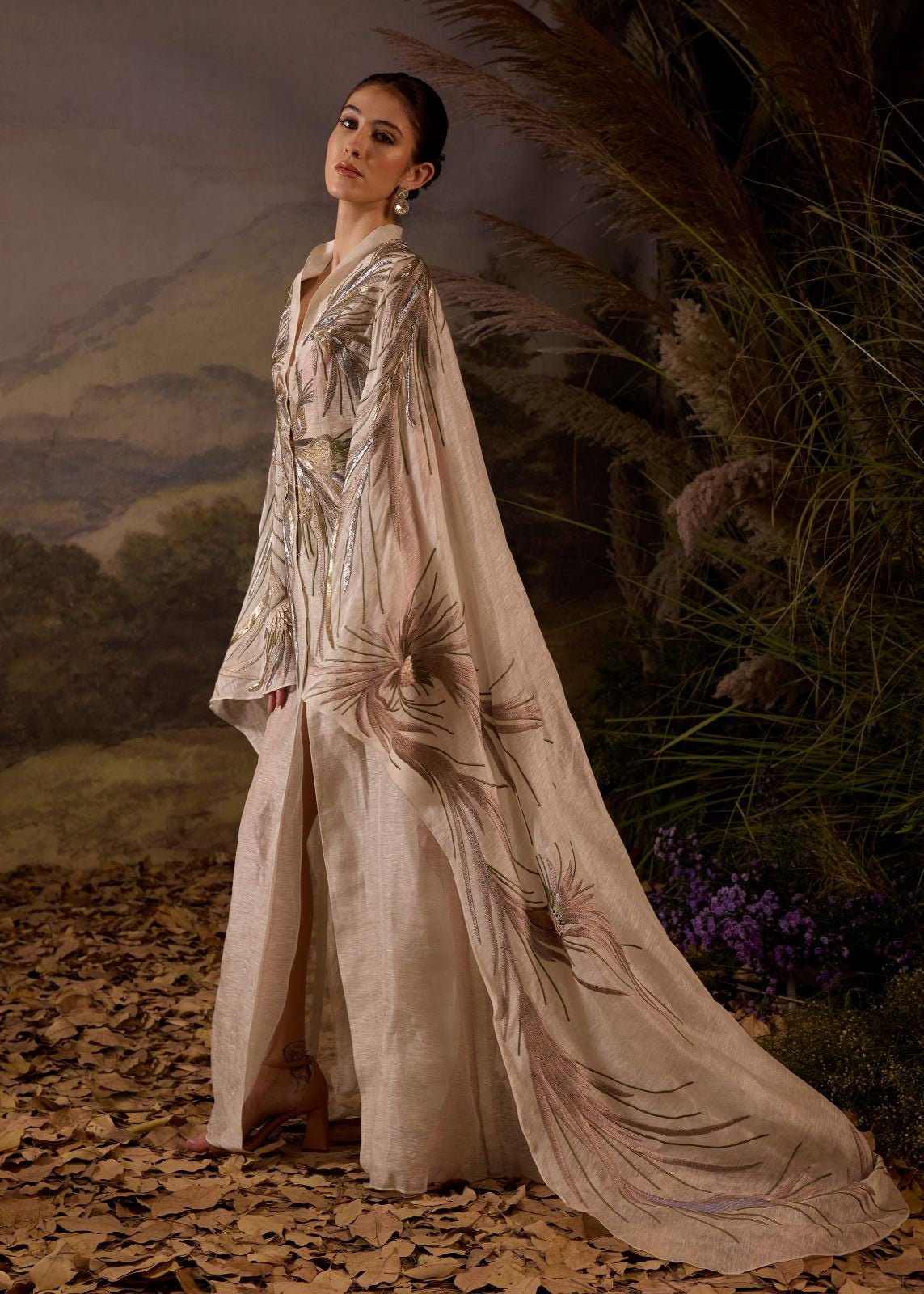 https://cdn.shopify.com/s/files/1/0088/3441/6706/files/ivory-hand-embroidered-cape-overlay-with-botanical-motifs-2502383.jpg?v=1753781125