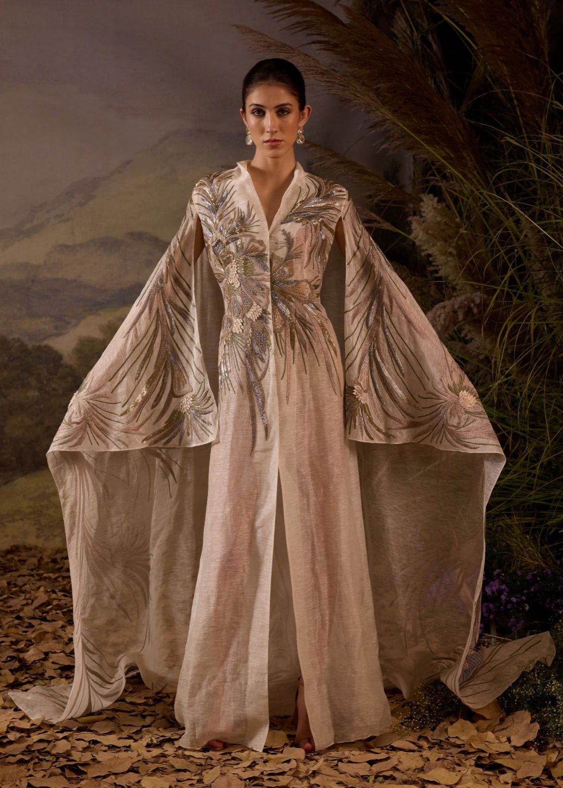 https://cdn.shopify.com/s/files/1/0088/3441/6706/files/ivory-hand-embroidered-cape-overlay-with-botanical-motifs-7046213.jpg?v=1753781124