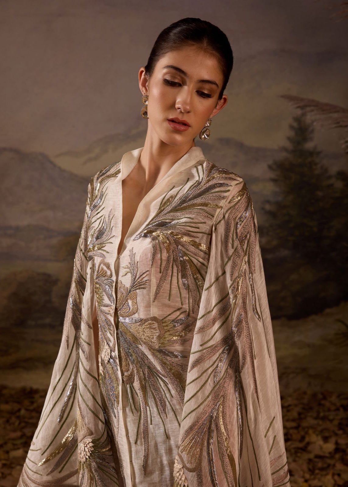 https://cdn.shopify.com/s/files/1/0088/3441/6706/files/ivory-hand-embroidered-cape-overlay-with-botanical-motifs-8196690.jpg?v=1753781125