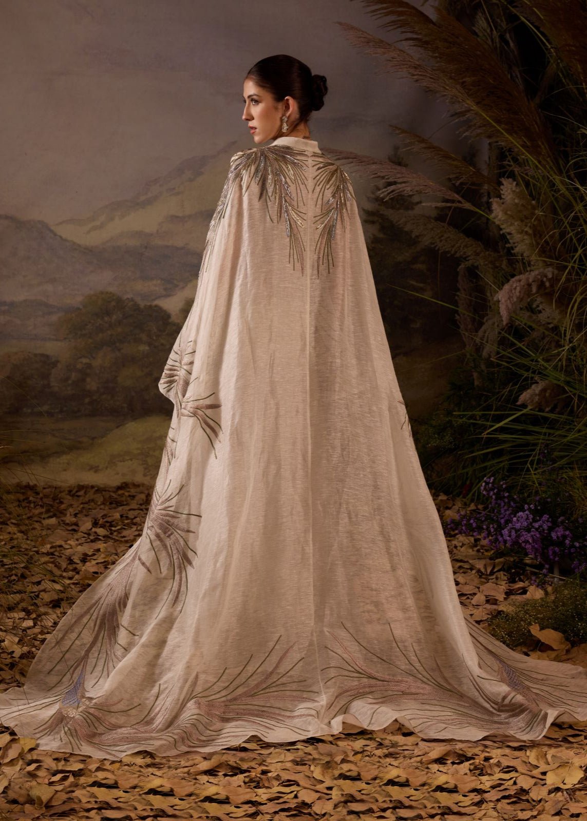 https://cdn.shopify.com/s/files/1/0088/3441/6706/files/ivory-hand-embroidered-cape-overlay-with-botanical-motifs-9920390.jpg?v=1753781125