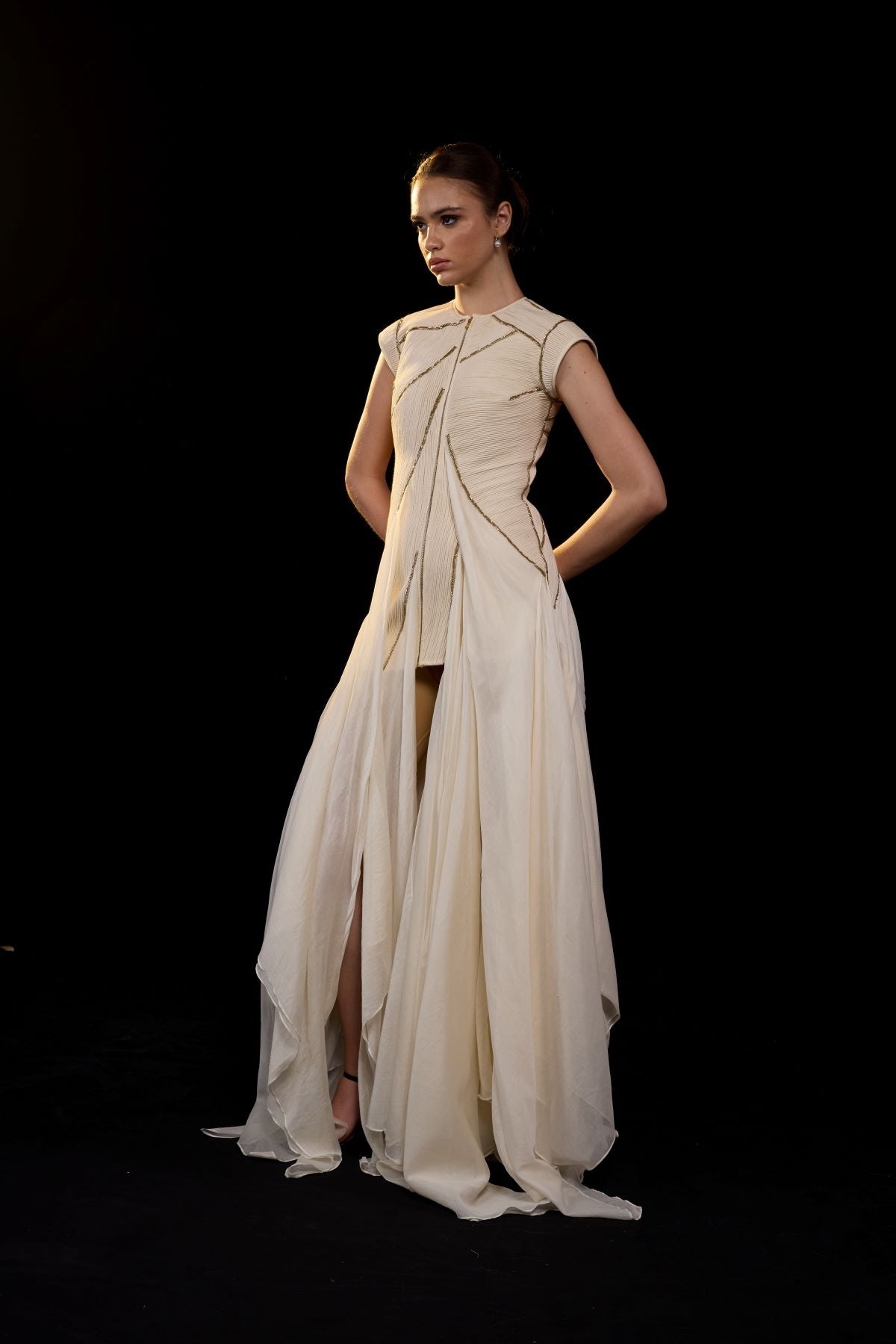 https://cdn.shopify.com/s/files/1/0088/3441/6706/files/ivory-structured-gown-with-a-sculpted-bodice-and-flowing-layered-panels-9240919.jpg?v=1752388529