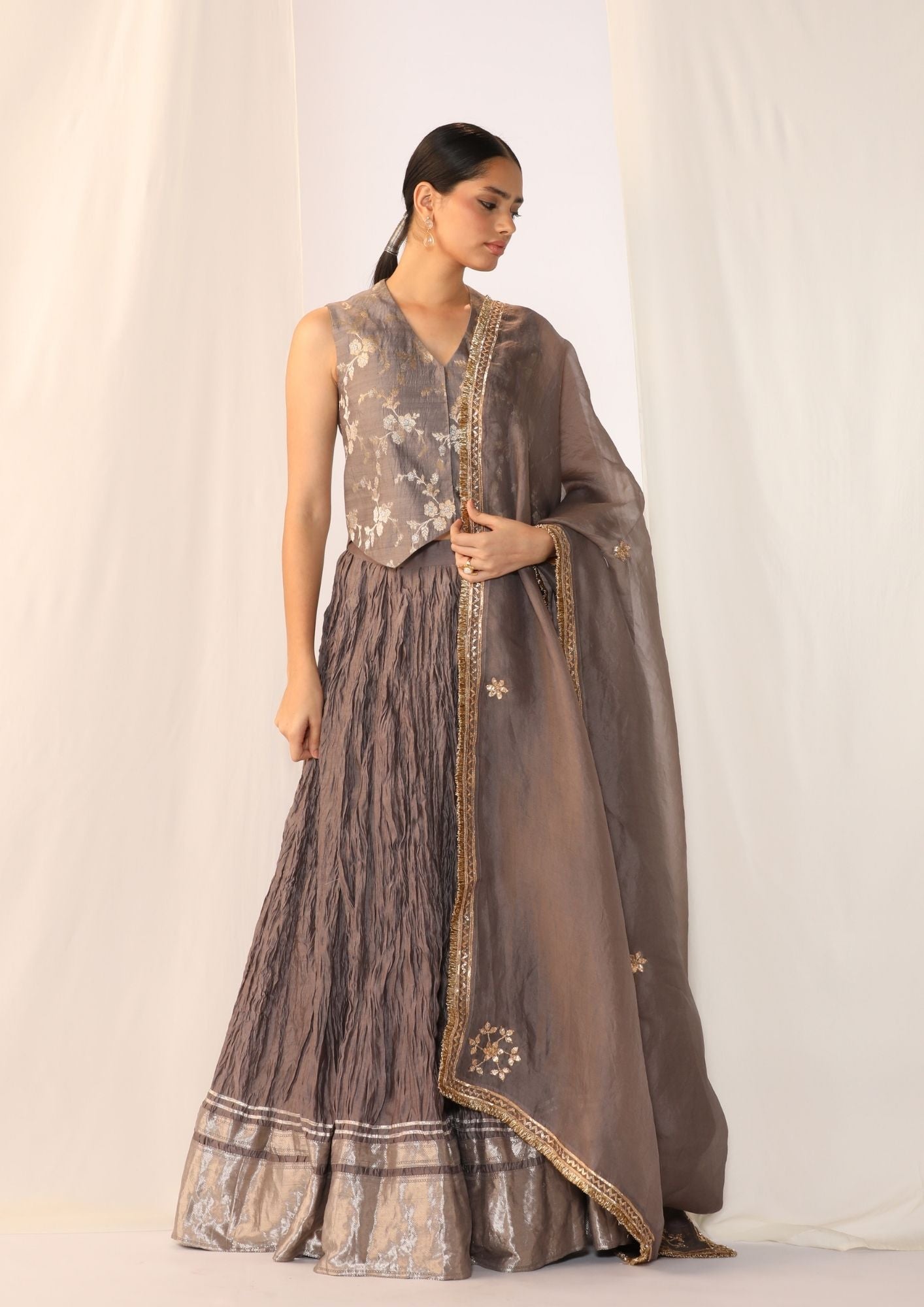 Brocade waistcoat paired with a crushed skirt with organza dupatta with gota work
