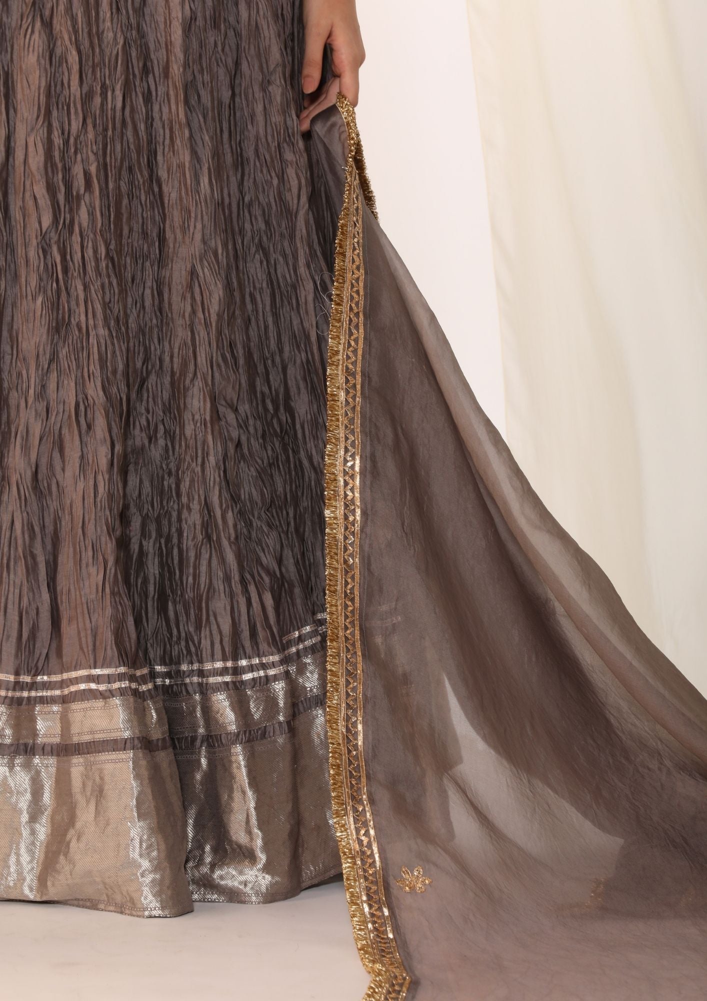 Brocade waistcoat paired with a crushed skirt with organza dupatta with gota work