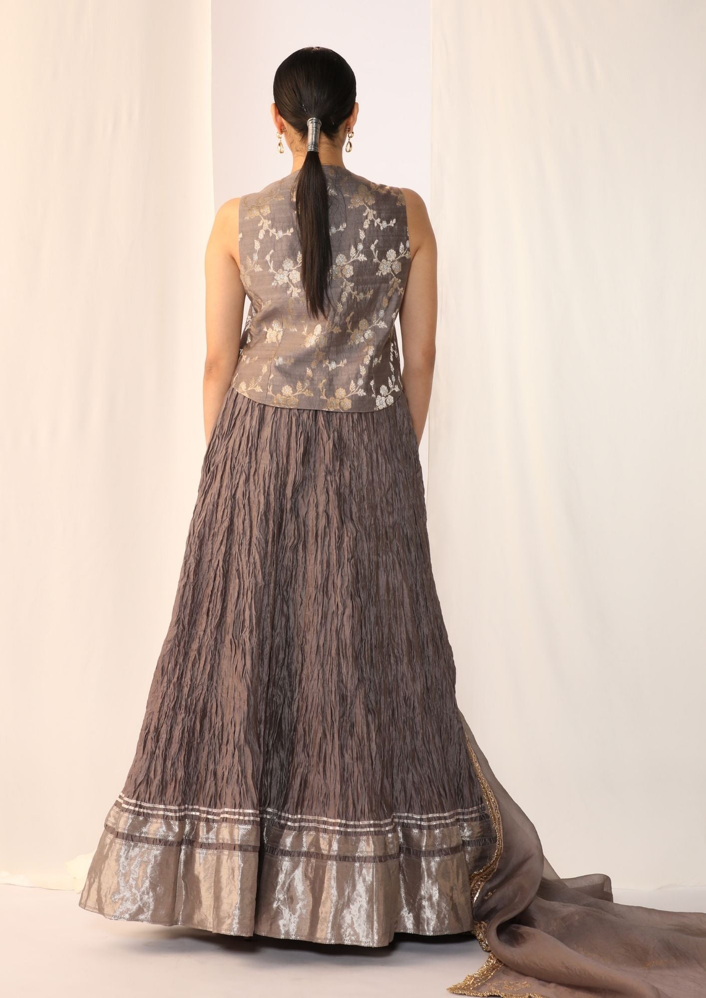 Brocade waistcoat paired with a crushed skirt with organza dupatta with gota work