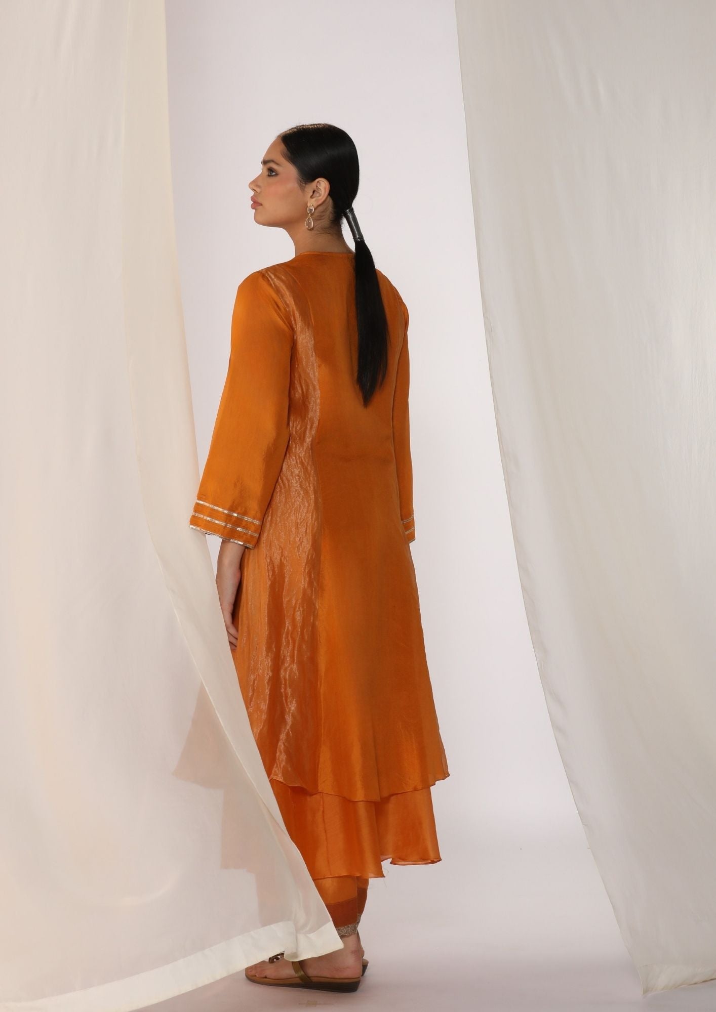 Double-layer kurta with  handwork  on neckline paired with pants
