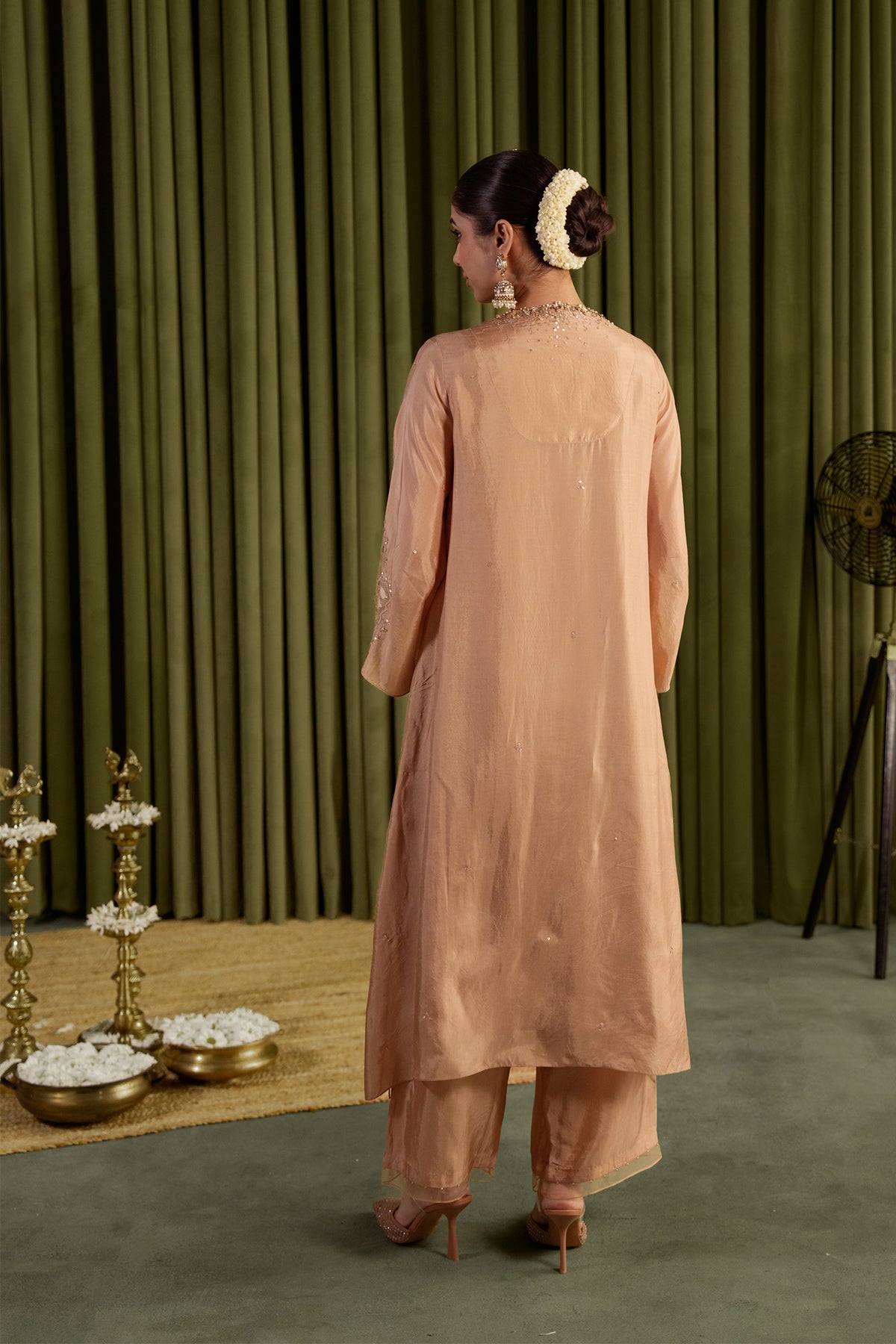 Golden beige kurta set in viscose silk base with embroidered magnolia flower pattern.
