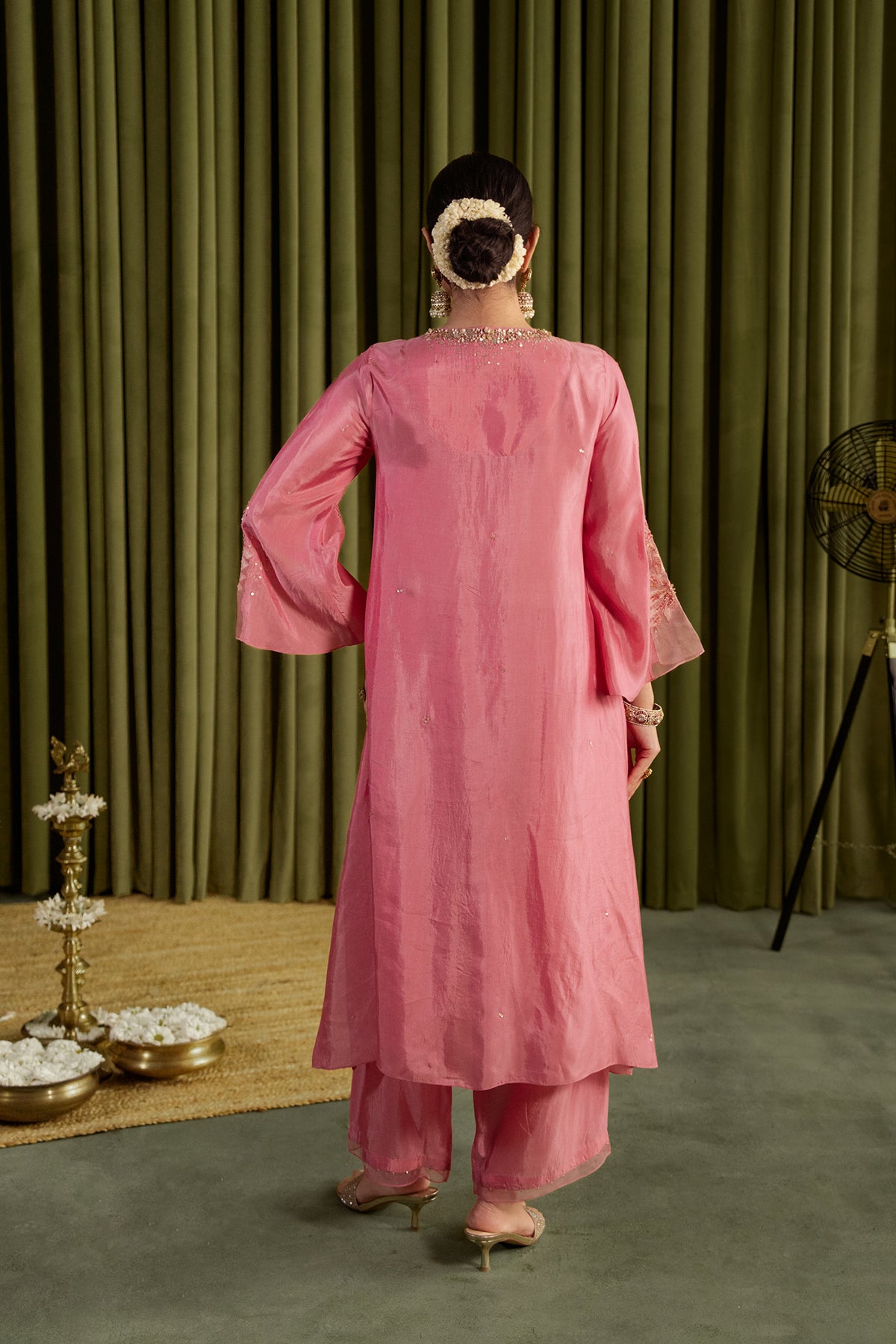 Rose pink kurta set in viscose silk base with embroidered magnolia flower pattern.