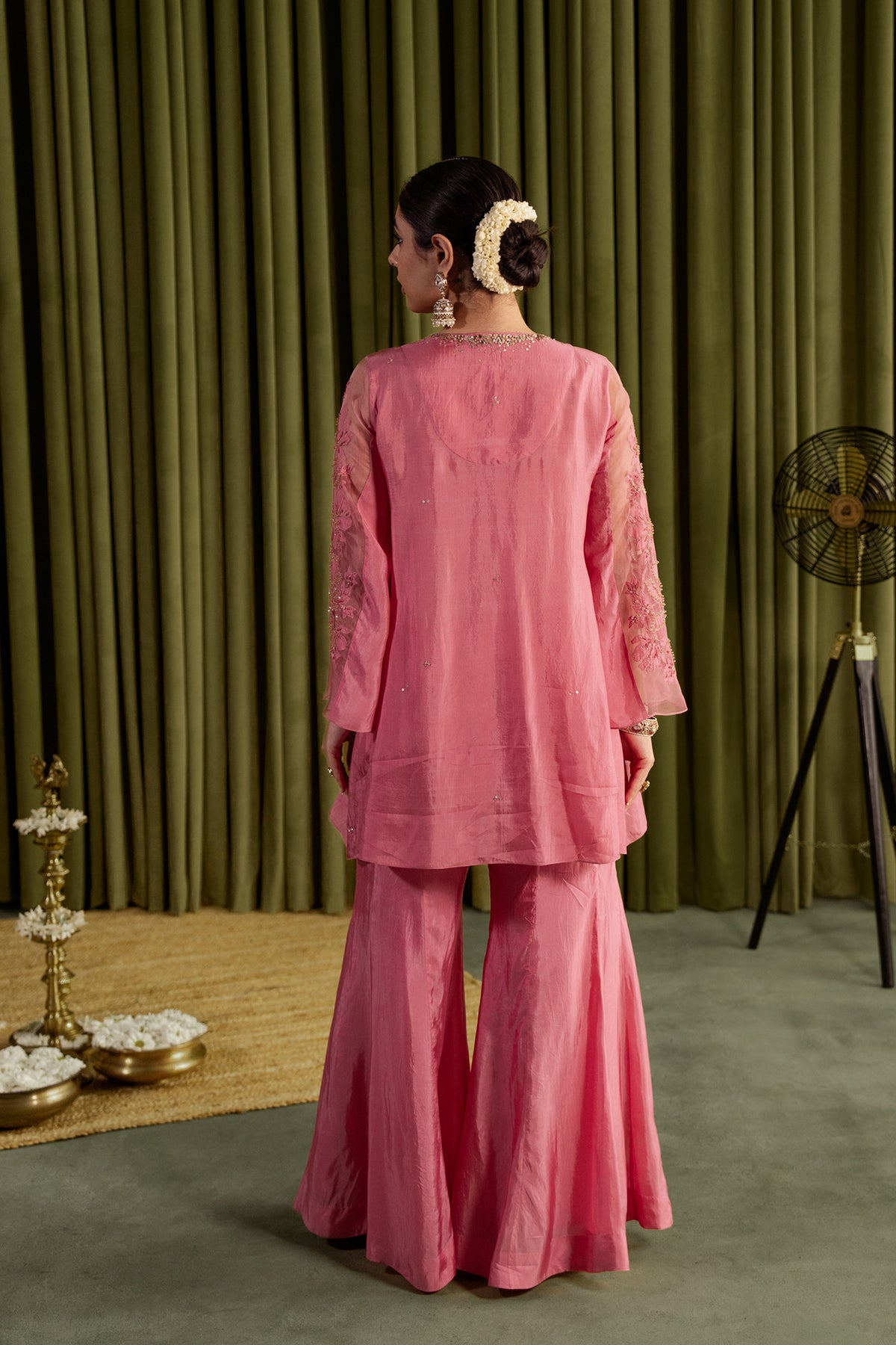 Rose pink sharara set with embroidered magnolia flower pattern.