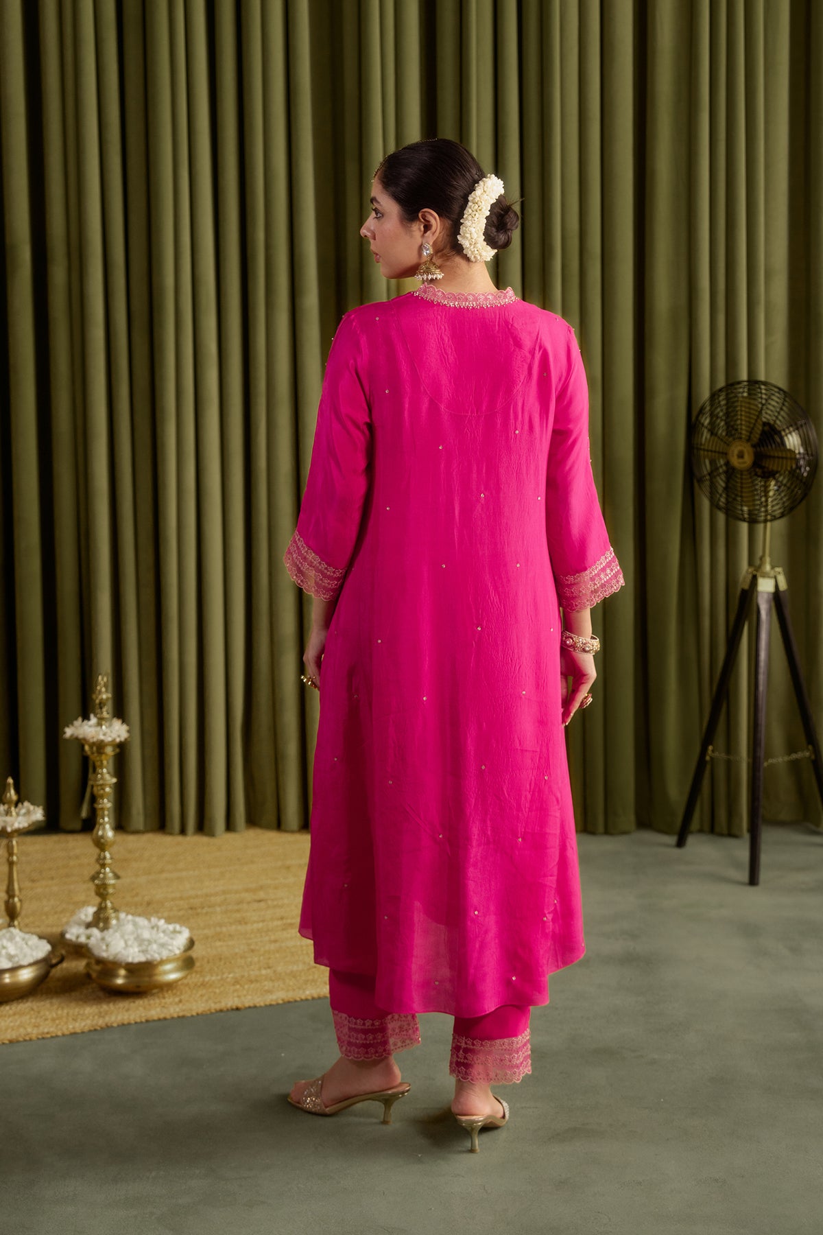 Hot pink kurta set with delicate floral embroidery.