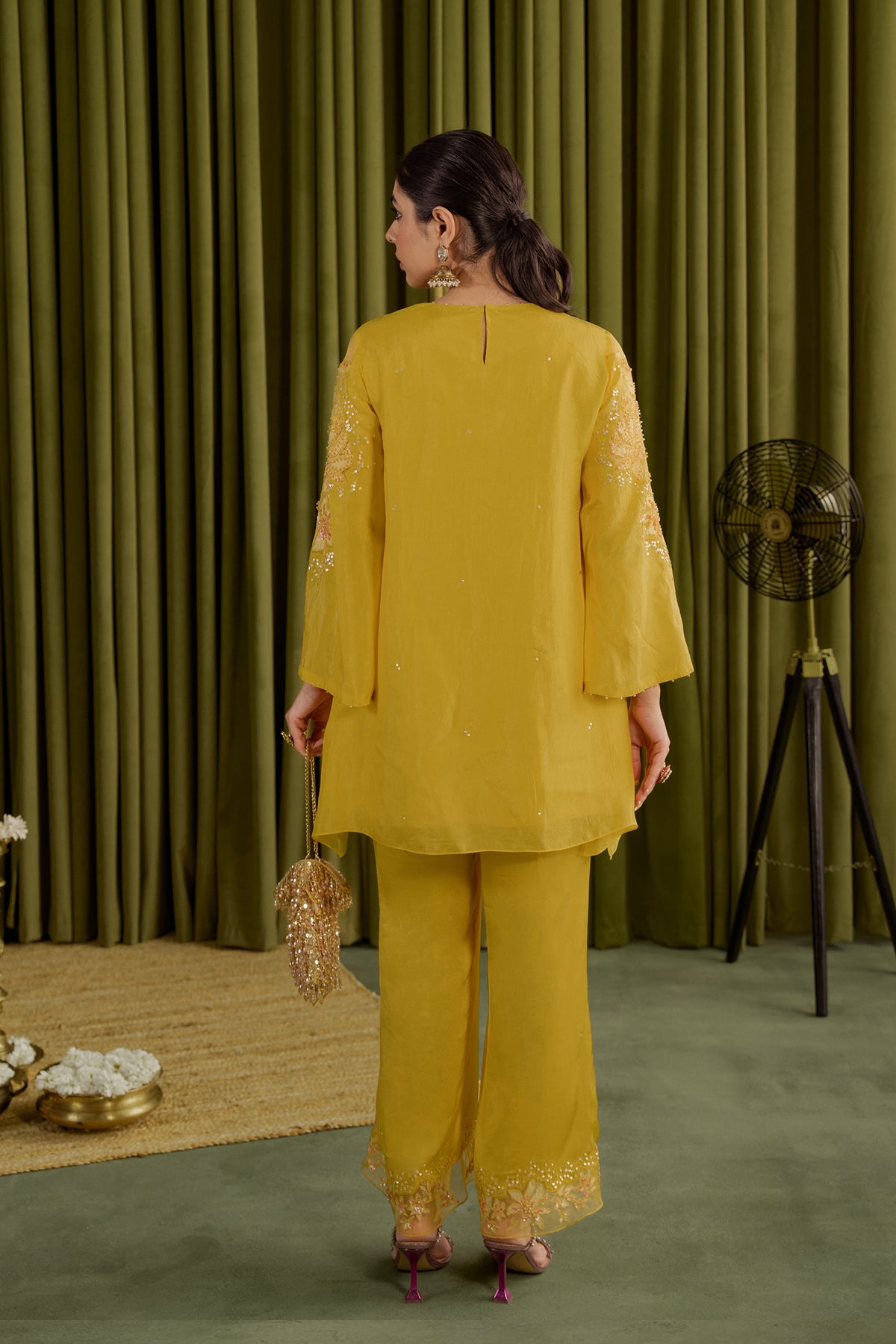 Mango co-ord set with embroidered magnolia flower pattern.