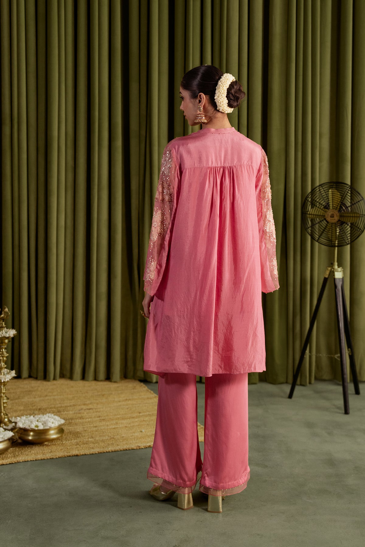 Rose pink co-ord set with embroidered floral pattern.