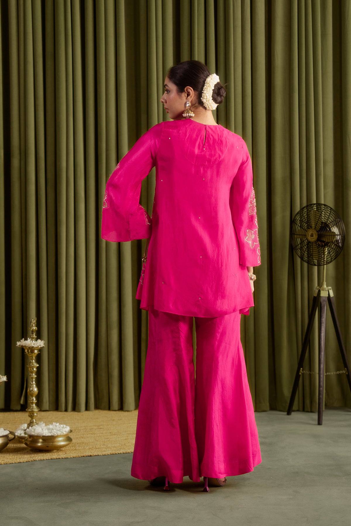 Hot pink sharara set with hand embroidered floral pattern.