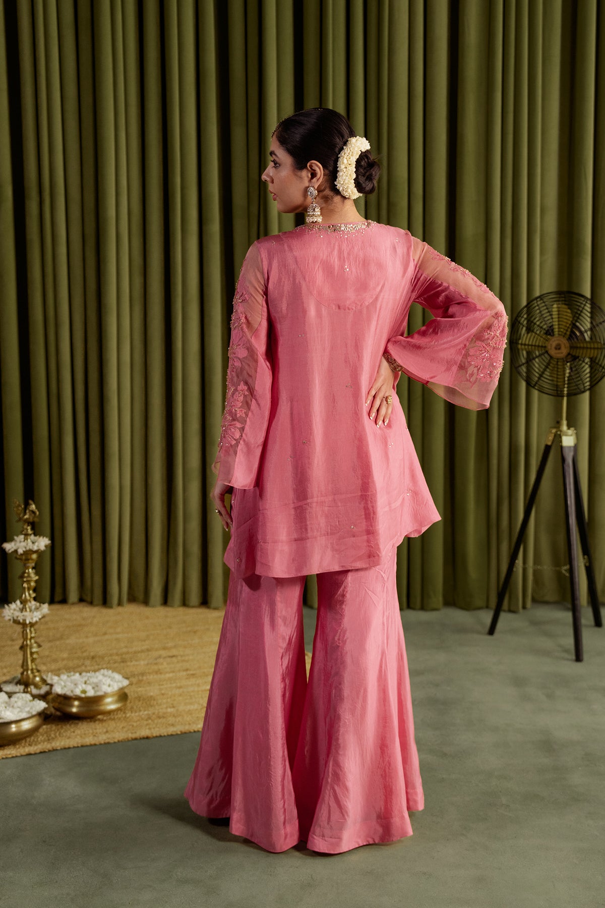 Rose pink sharara set with embroidered magnolia flower pattern.